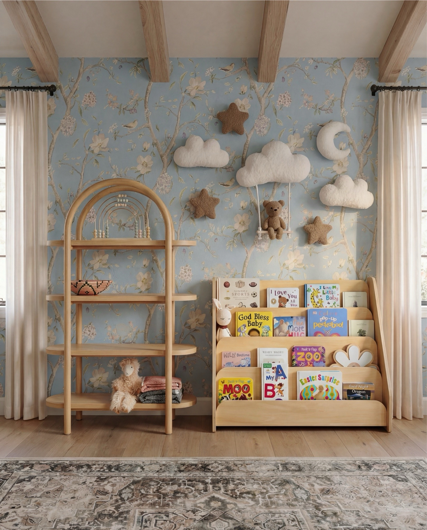 Shop the Look:
• Light blue floral wallpaper
• Natural wood exposed ceiling beams
• Solid wood crib (warm oak tone)
• Neutral crib mattress + fitted sheet
• Knit baby blanket (soft brown)
• Vintage-inspired area rug (muted blue + beige)
• Wood dresser with woven drawer fronts
• Round gold-framed wall mirror
• Brass table lamp with white shade
• White boucle accent chair
• Round upholstered pouf (cream)
• Wooden toy shelving unit
• Front-facing wooden book rack
• Children’s board books (colorful covers)
• Plush teddy bear
• Soft cloud wall decor
• Star-shaped wall pillows (neutral tones)
• Crescent moon wall decor
• Beaded rainbow toy
• Sheer white curtain panels
• Black curtain rod with rings

#LTKHome #LTKSaleAlert