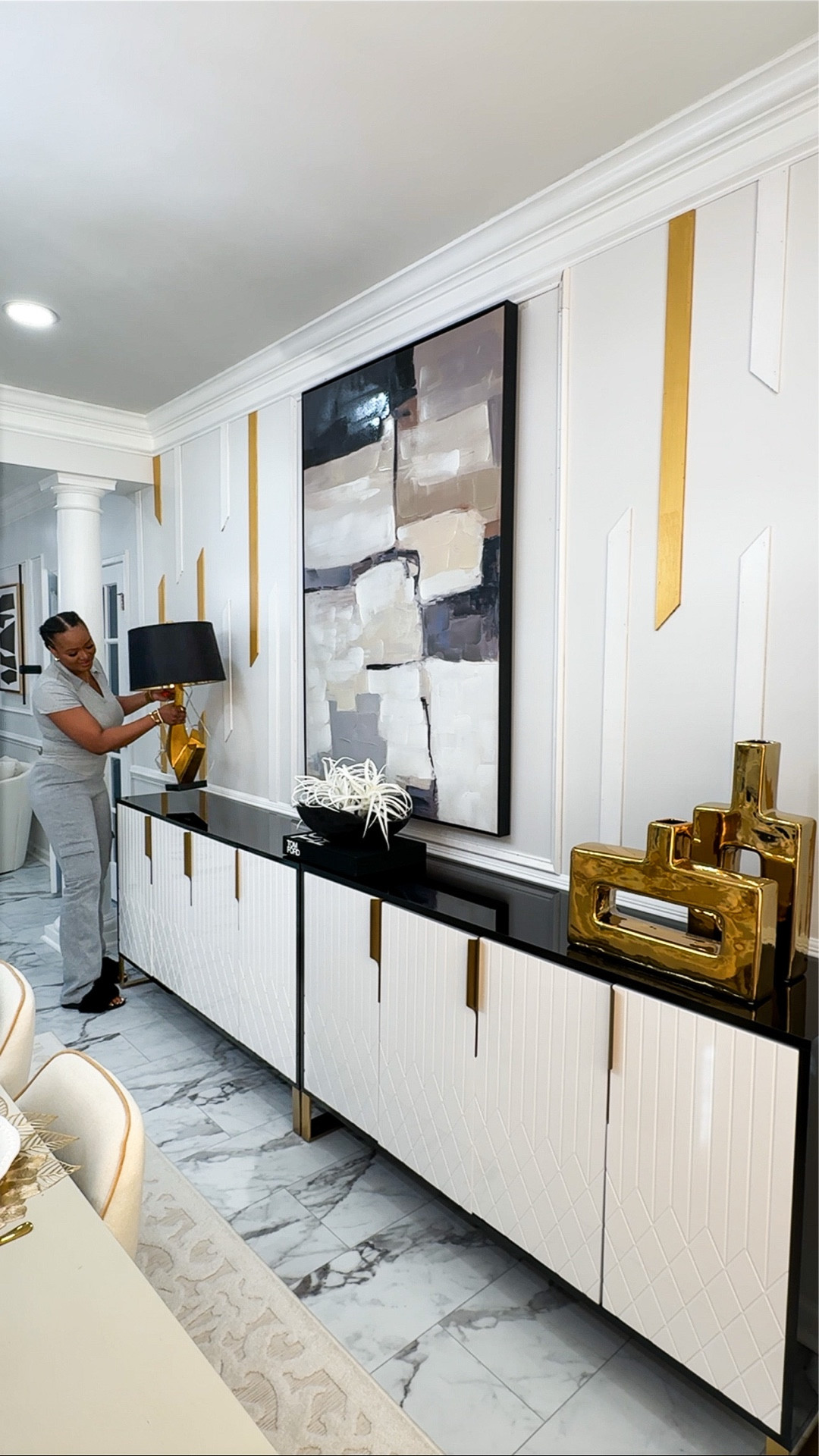 Thinking of elevating an empty wall? Using décor pieces like Wall art, canvas frame, moldings, sconces and even sideboards makes a huge difference.
I love to double my credenza for extra wide walls which helps fill in a lot of the space and give your home an elevated appearance.

#LTKHome #LTKU #LTKSaleAlert