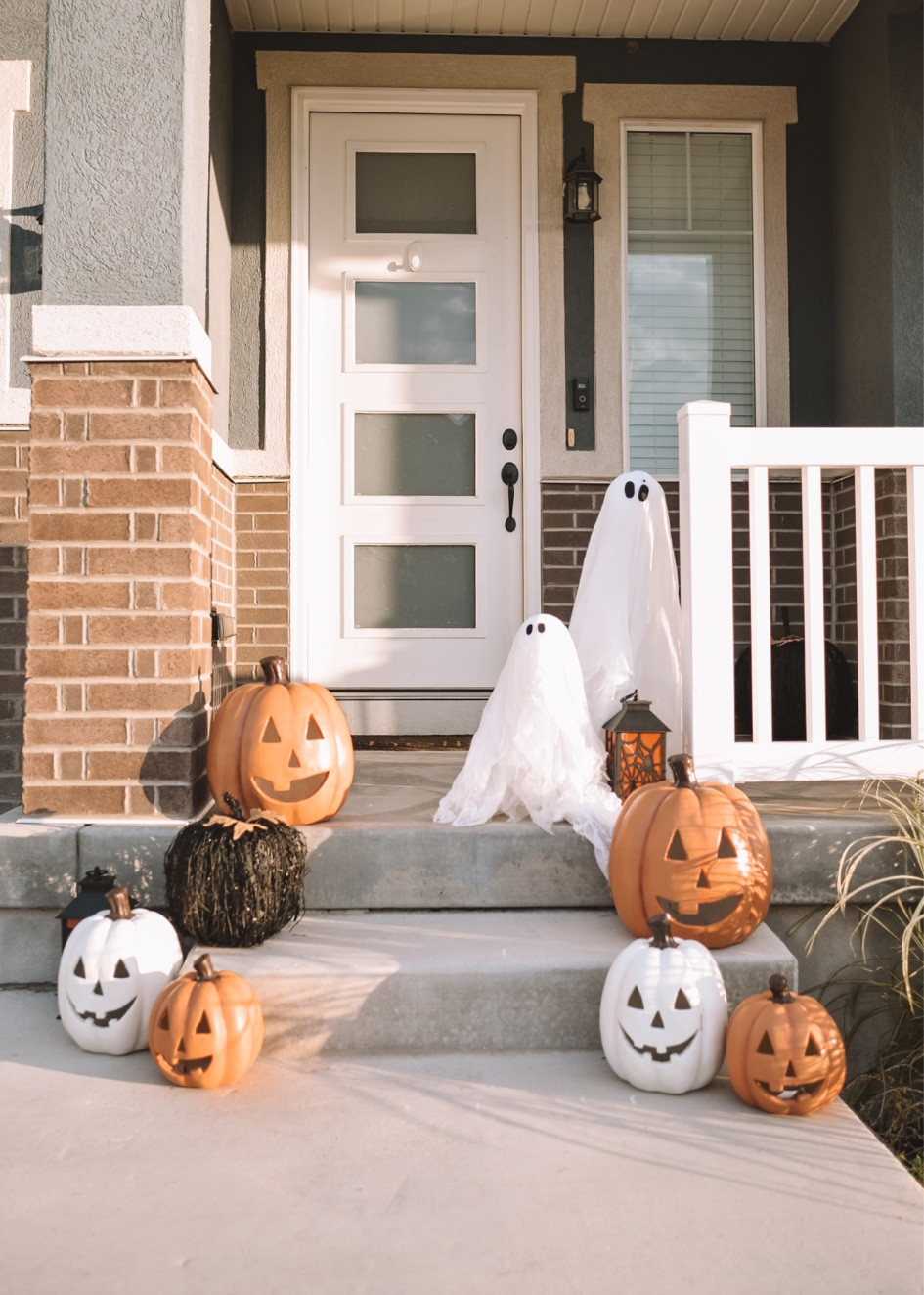 Halloween Front Porch Decor - the cutest pumpkins, Halloween lanterns, hanging witches hats and those little ghosts are so adorable! 

#LTKHalloween #LTKHome #LTKFamily