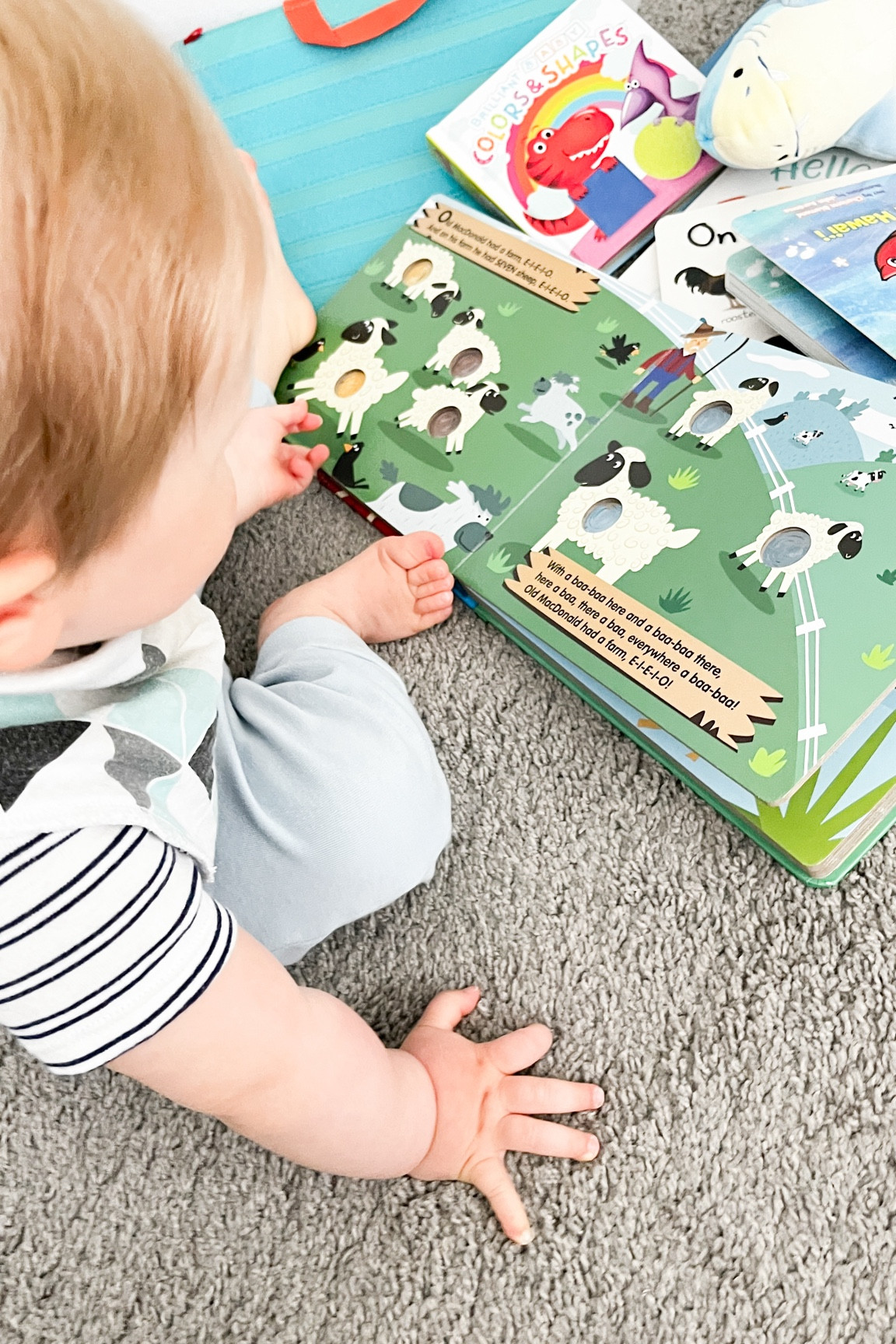 Baby boy loves his popping poke-a-dot it books that help keep him interested and engaged in this fun old McDonald had a farm book! 📚 

Also pictured are his Hawaiian slippery fish we love to sing and read to him (look up the song! Kids love it!) and dinosaur colors and shapes touch and feel book  🦕 

Baby books, toddler books, summer reading 

#LTKKids #LTKBump #LTKBaby