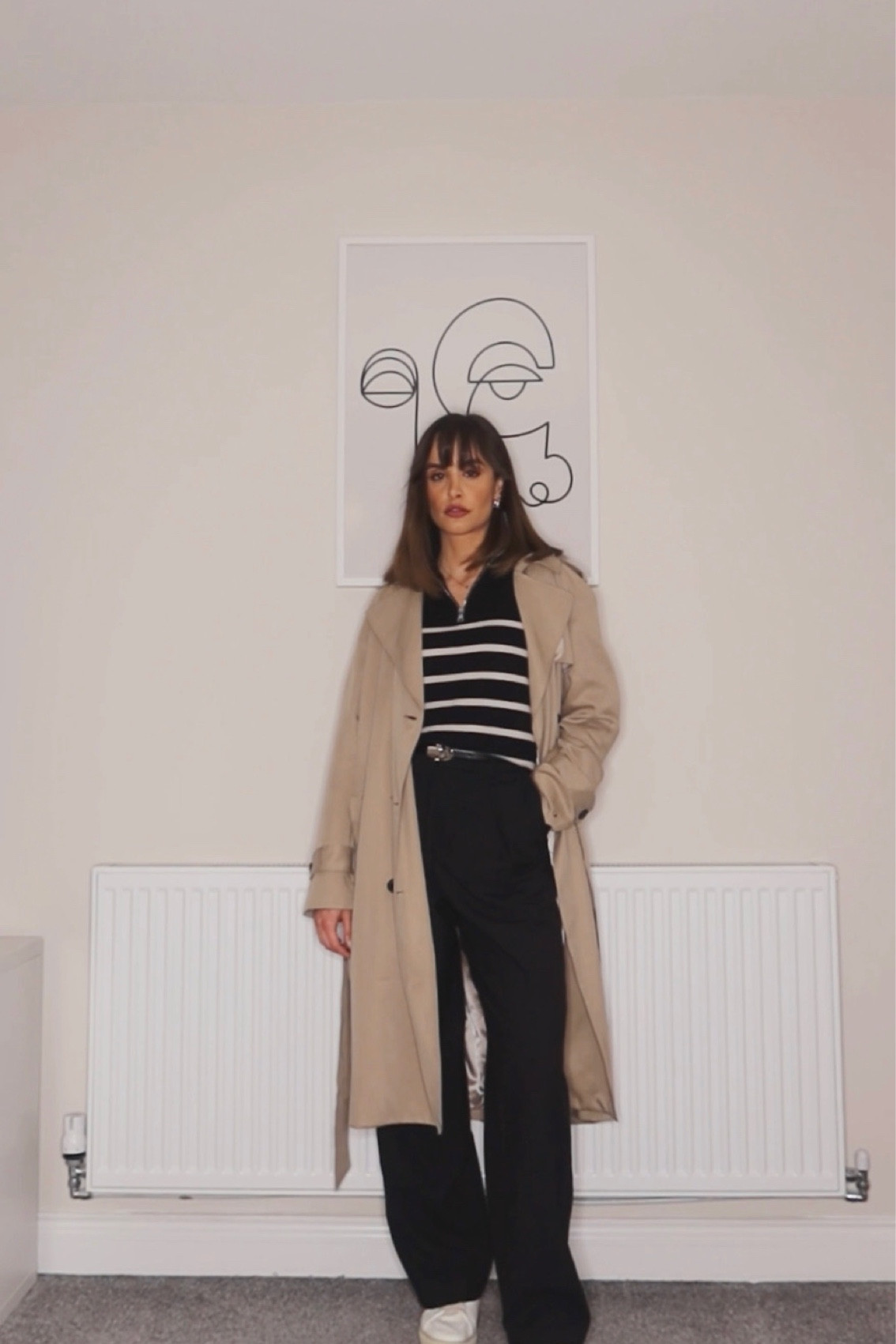 Brown trench coat, black straight trousers, black striped jumper, half zip up jumper, white trainers, black belt

#LTKstyletip #LTKSeasonal #LTKeurope