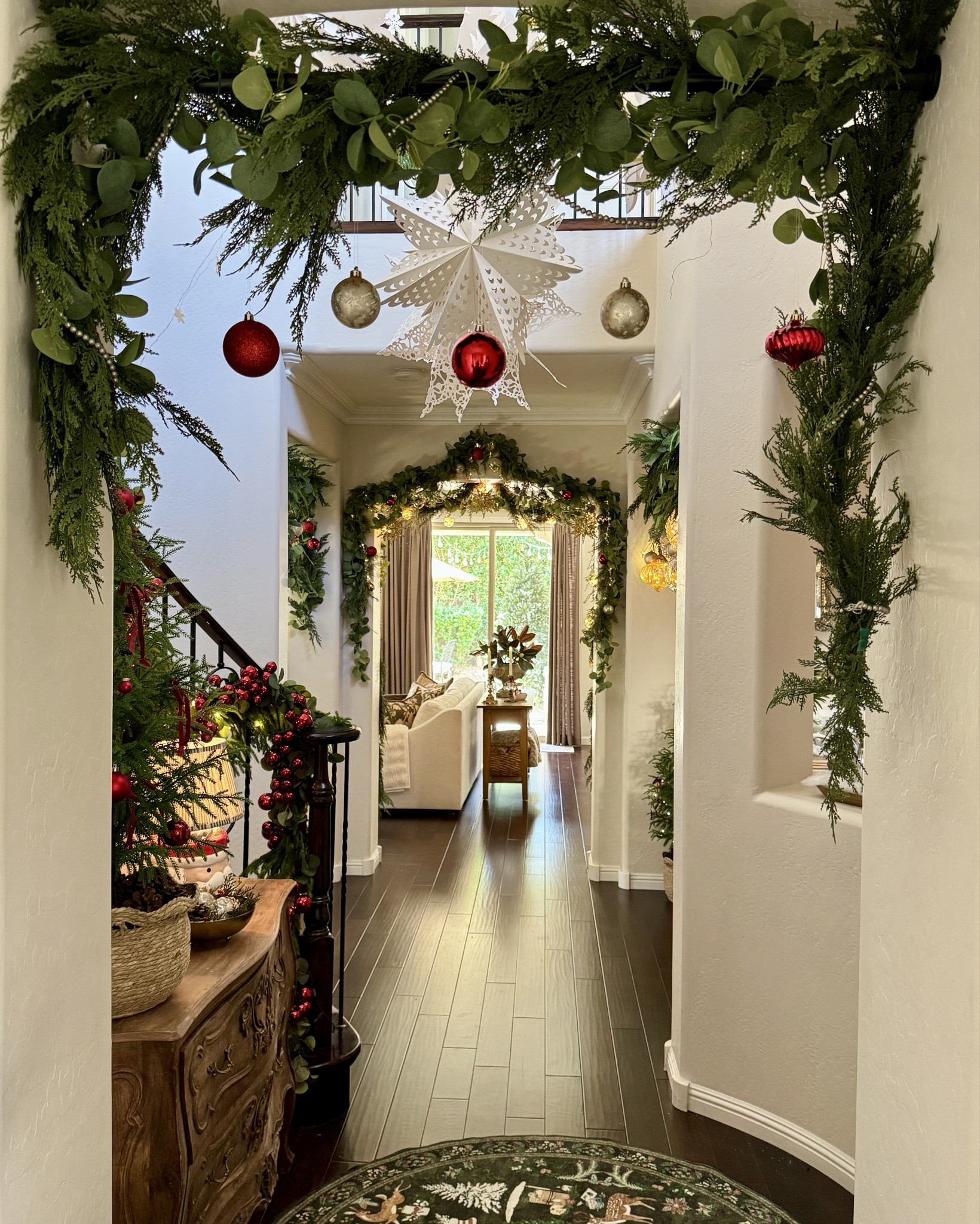 Tension Rod/Curtain Rods over my archways decorated with garlands and ornaments for an easy way to add cheerful Christmas ambiance. 

#christmasdecor #christmasgarlands #holidaydecor 

#LTKHoliday #LTKSeasonal #LTKHome