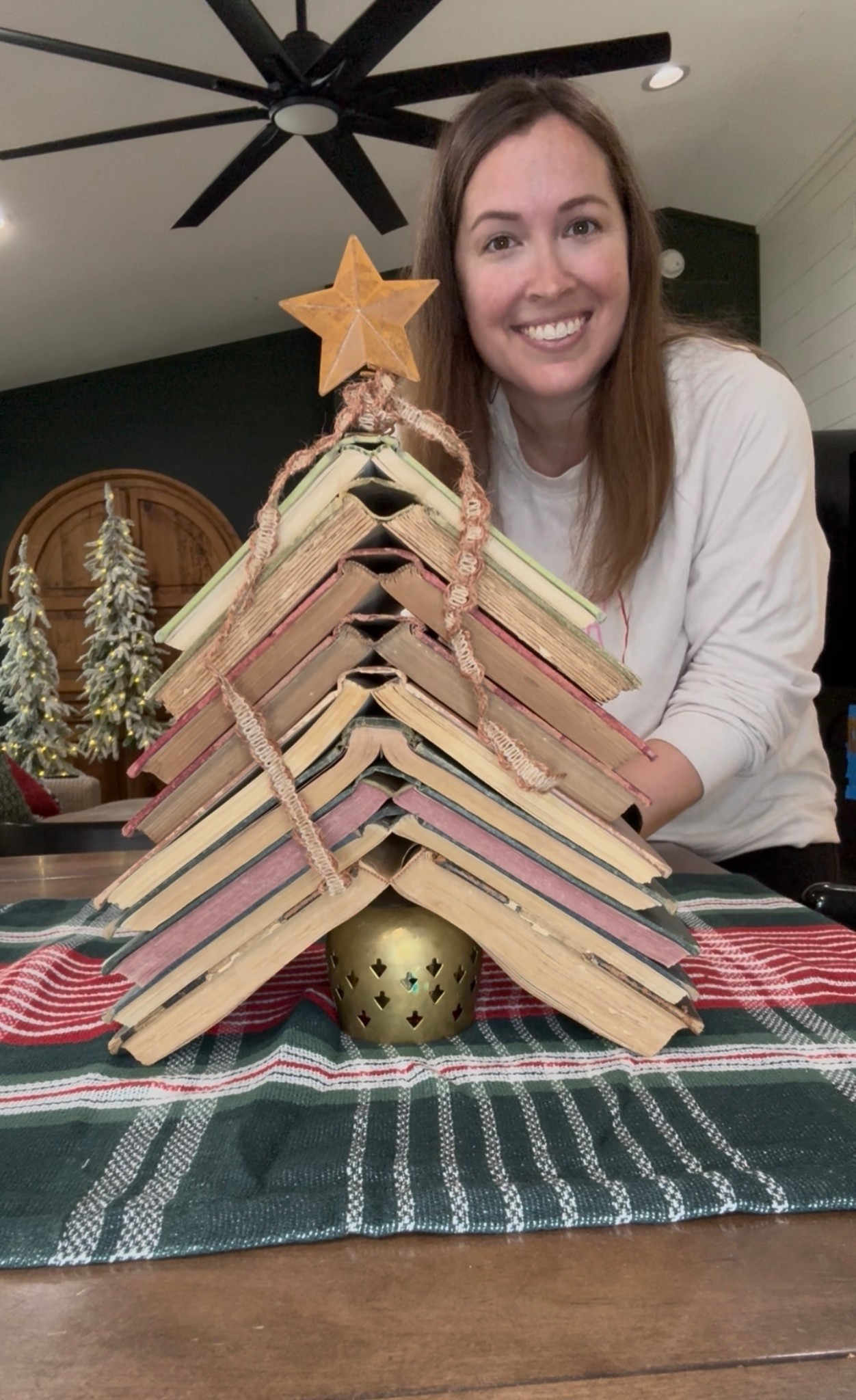 Antique Christmas Book Tree, antique books, small metal star tree topper, jute ribbons, brass candle holders, vintage Christmas decor 

#LTKHoliday #LTKHome #LTKSeasonal