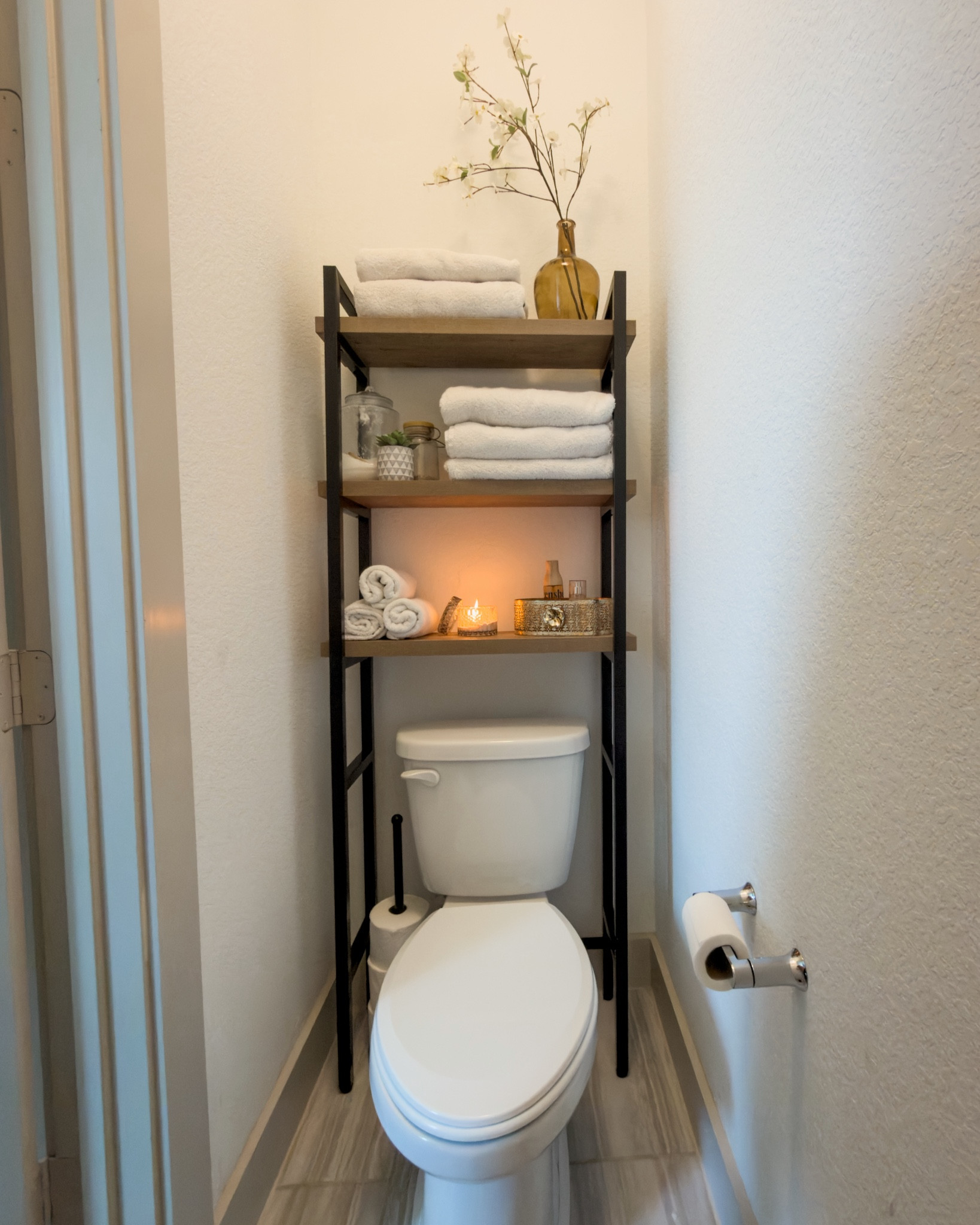 No linen closet, so got this shelf from Walmart (and toilet paper holder) 