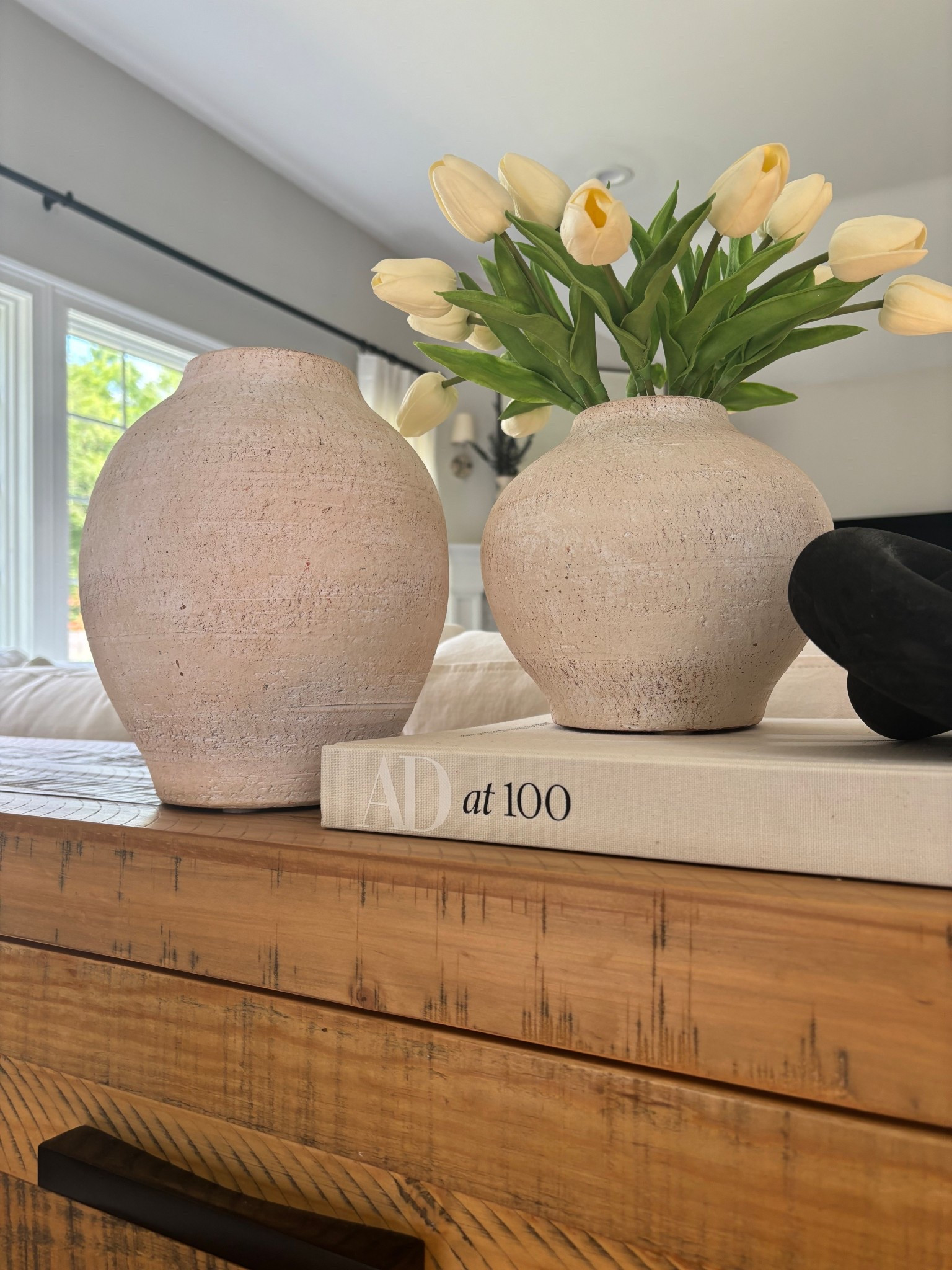 realistic faux tulips for Spring! 🌷

.
.
spring home decor
living room spring refresh
realistic silk tulips
real touch tulips
real touch spring florals 
affordable spring decor
spring home refresh
organic ceramic vases
budget ceramic modern vases
hardcover coffee table book
affordable wooden consoles
#springrefresh #silkflorals

#LTKSeasonal #LTKHome #LTKSpringSale