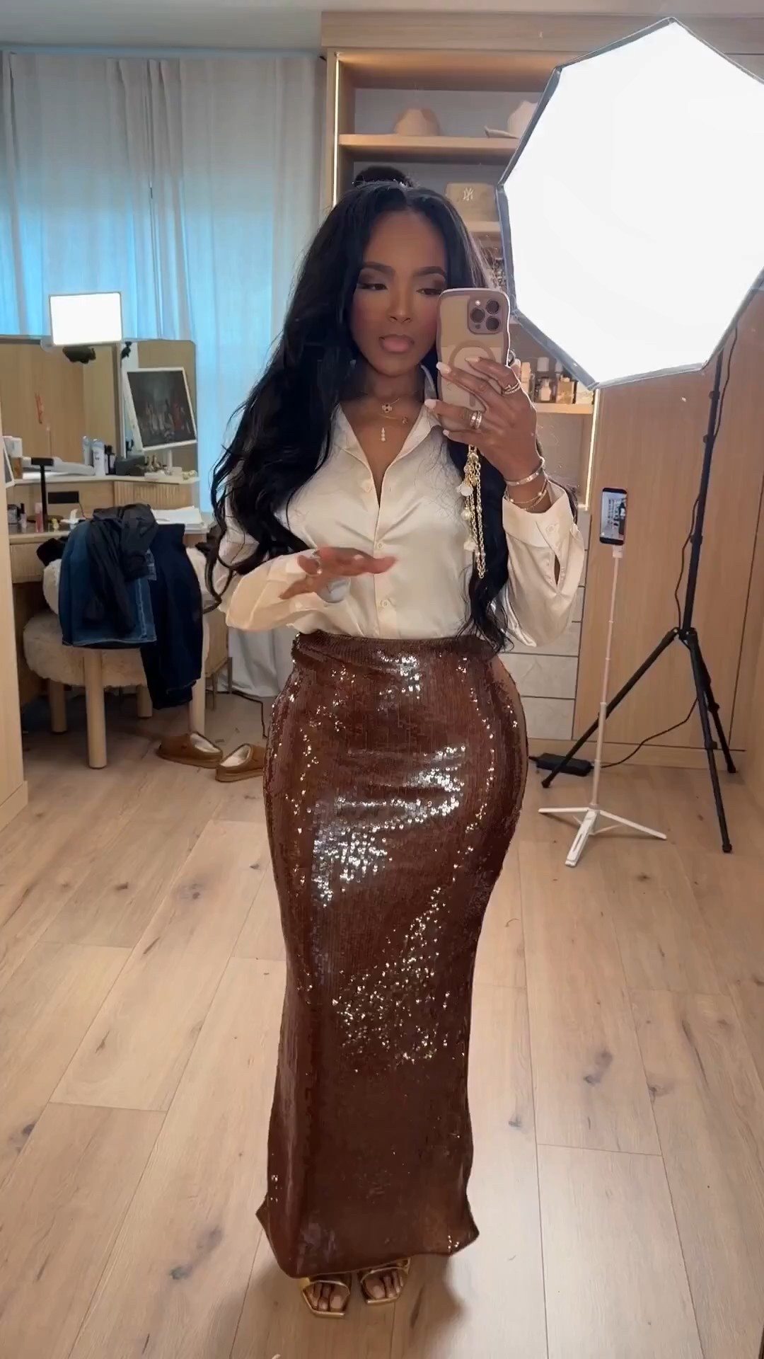 ✨ Polished Glam, Effortlessly Balanced

A silky button-down paired with a rich brown sequin midi creates that perfect high–low contrast. The fluid drape of the top keeps the look relaxed and chic, while the shimmer skirt adds just enough drama to make it feel special. Each piece styles easily on its own, making this a smart cost-per-wear win for dressy moments all season long.

Perfect for:
• Holiday parties
• Cocktail events
• Date nights
• Dressy dinners

📏 Sizing:
Top: Small
Skirt: Small
Shoes: True to size

Measurements:
5’4” · 138 lbs · 34D · 27” waist · 40” hips

Tap to get details.

Brown sequin skirt outfit inspiration, elevated holiday style, chic evening outfits, neutral glam looks, feminine night-out styling.

Follow me on Instagram and YouTube @kirasfashionfinds

#LTKootd #LTKPetite