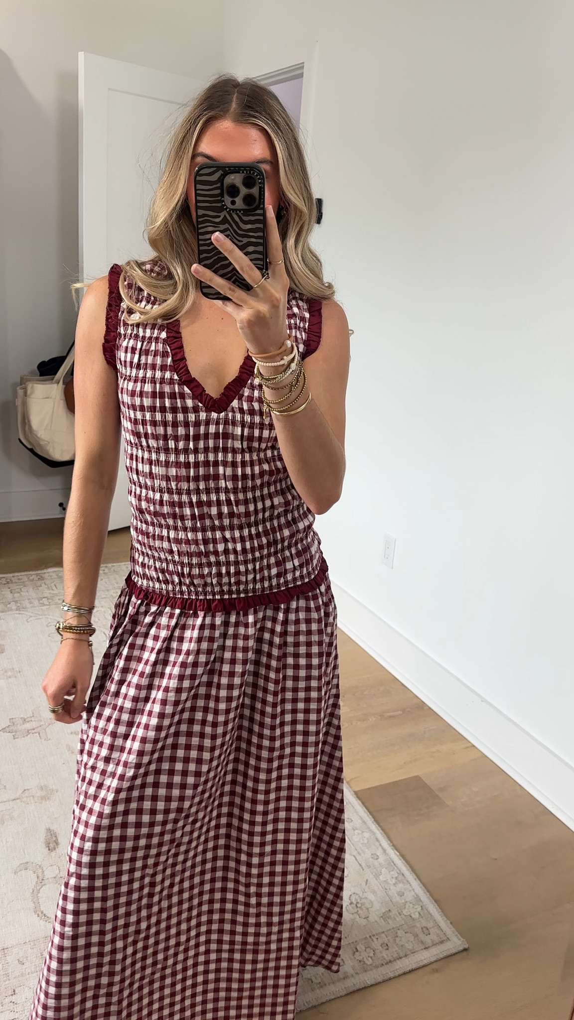@Petal & Pup size xs 
This burgundy gingham stunner delivers effortless chic with a silhouette that feels just as good as it looks. You will love the secure, comfortable fit of the elasticised shirred bodice, paired perfectly with wide non-adjustable straps that stay put all day long.

#LTKootd #LTKdayinmylife #LTKSeasonal