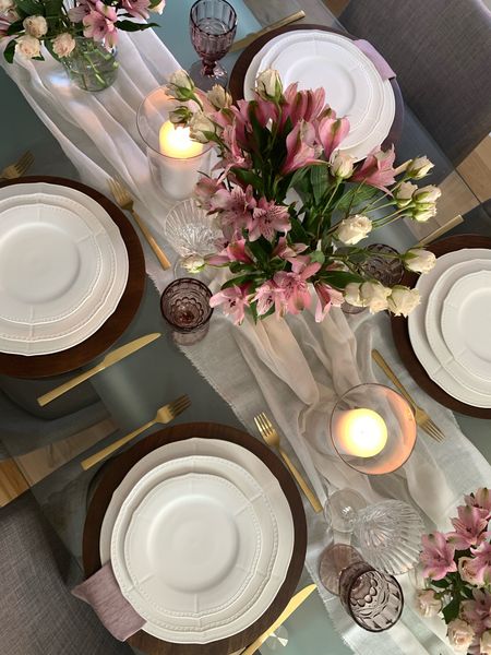 Thanksgiving tablescape in soft colour scheme using white dinnerware, old rose linen napkins, gold silverware and cheese cloth as a table runner. 

#LTKstyletip #LTKSeasonal #LTKhome
