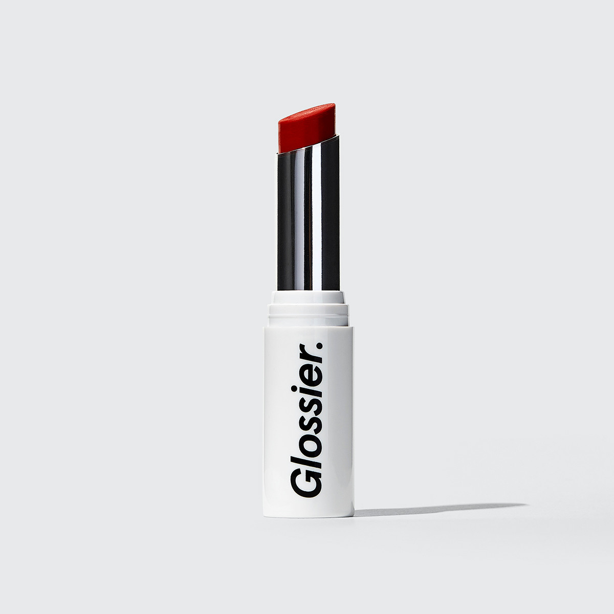Glossier Generation G Lipstick in Jam, a deep berry magenta, 0.07 oz, enhancing sheer matte lipstick that adapts to you | Glossier