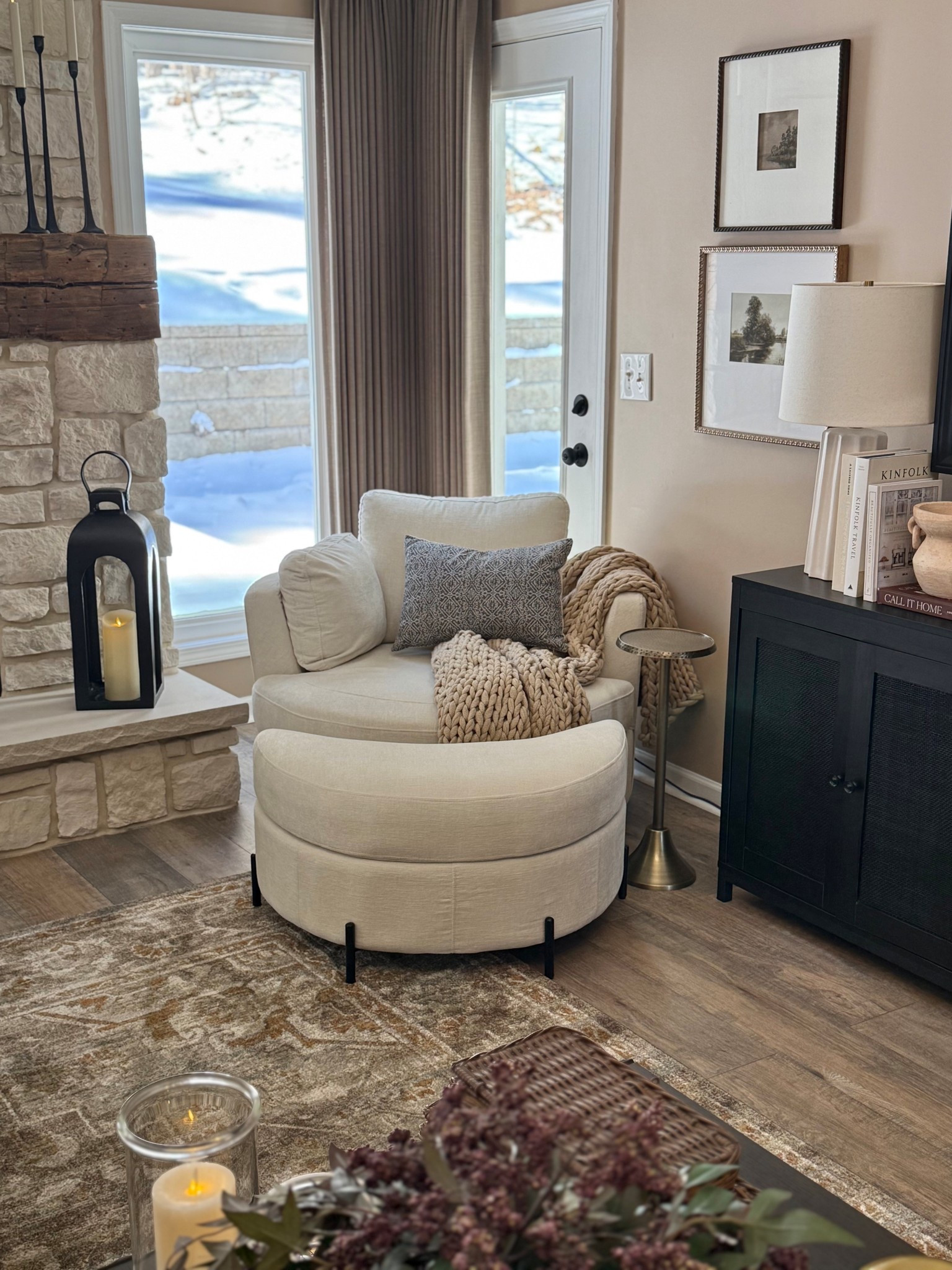 Cozy Neutral Reading Corner with Cream Swivel Chair

Follow @farmtotablecreations on Instagram for more home styling and decor finds.

This cozy corner is the perfect example of how a simple chair setup can make a space feel warm and inviting. A soft cream swivel chair paired with a chunky knit throw and textured accent pillow creates an ideal little reading spot by the fireplace. Adding a lantern with a flameless candle and a small drink table nearby keeps the space both functional and cozy, making it the kind of corner you’ll want to sit in all evening.

#accentchair #swivelchair #throwblanket #pillows #livingroomdecor #neutraldecor #lanterns #cozycorner #livingroomfurniture

#LTKHome #LTKSaleAlert