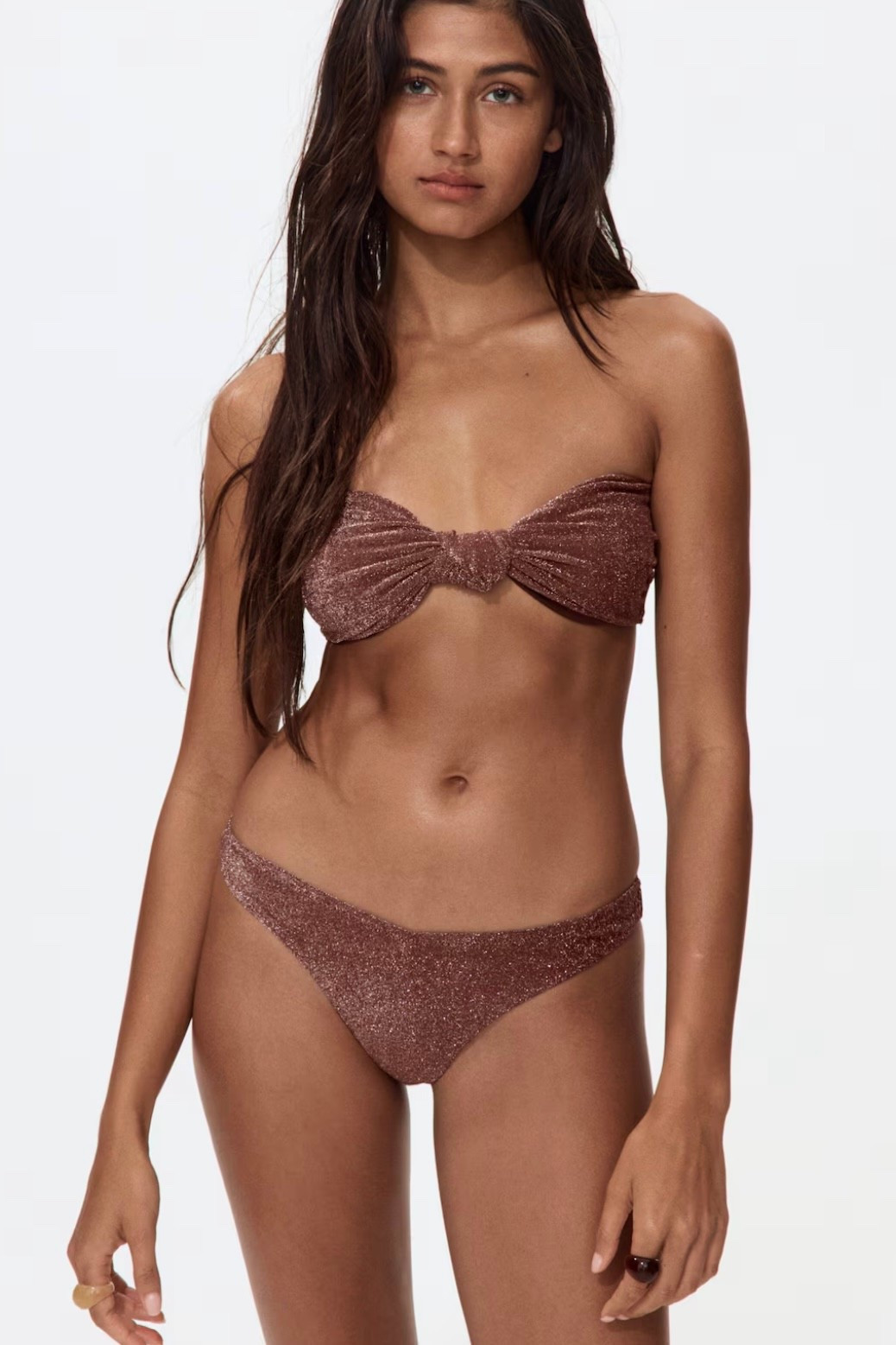 Shimmer bandeau bikini
Minimizes tan lines and stays minimal under summer outfits. Stretchy fabric for comfort without digging in. Easy for beach-to-pool transitions.

#LTKswimwear #LTKstyletip #LTKsummer