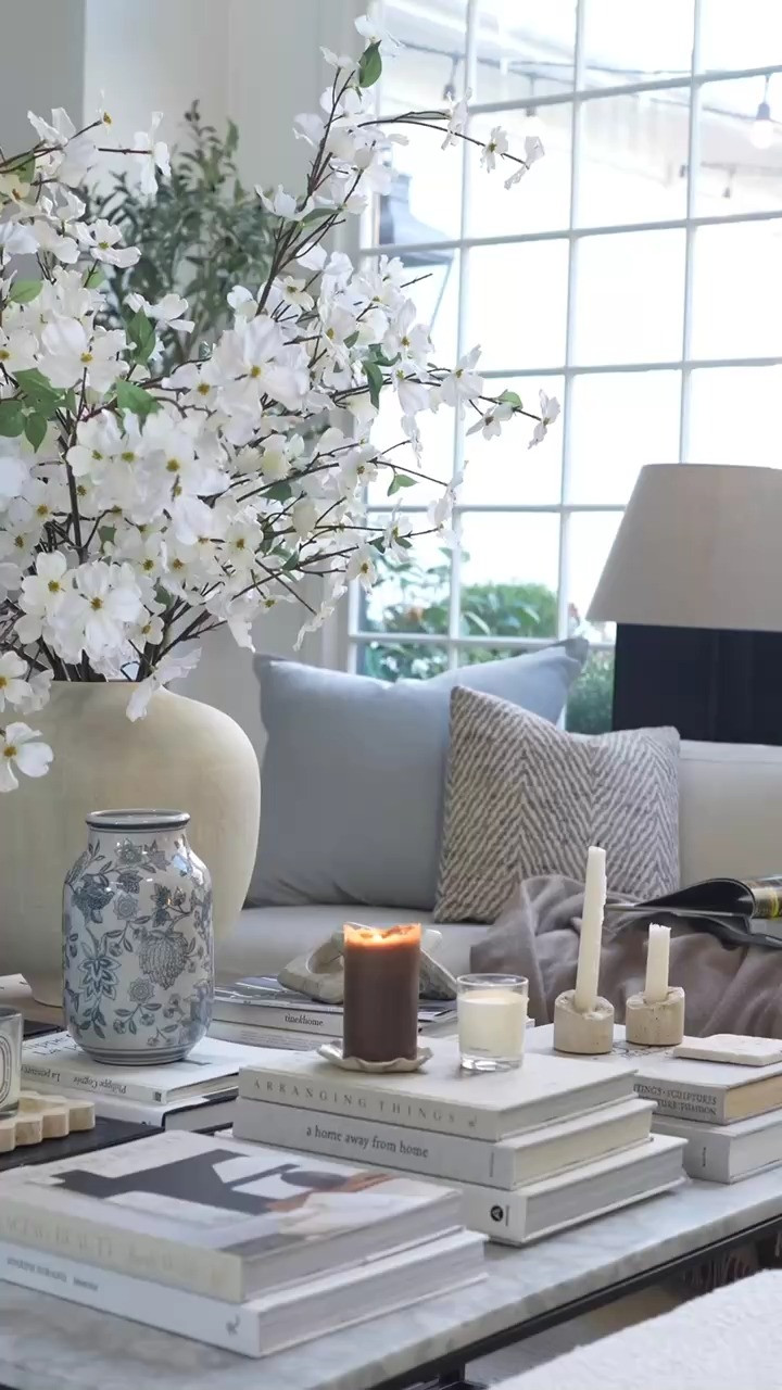 EEP I cannot believe how good this little find looks. This blue and white piece adds the prettiest pop of blue and suddenly my whole coffee table feels like spring. The stacked interior design books, warm candlelight, and a cozy couch moment with a good book has me completely obsessed. OMG these are the kind of decor finds that make me way too excited.  

 #LTKSpringSale #LTKSeasonal #LTKHome