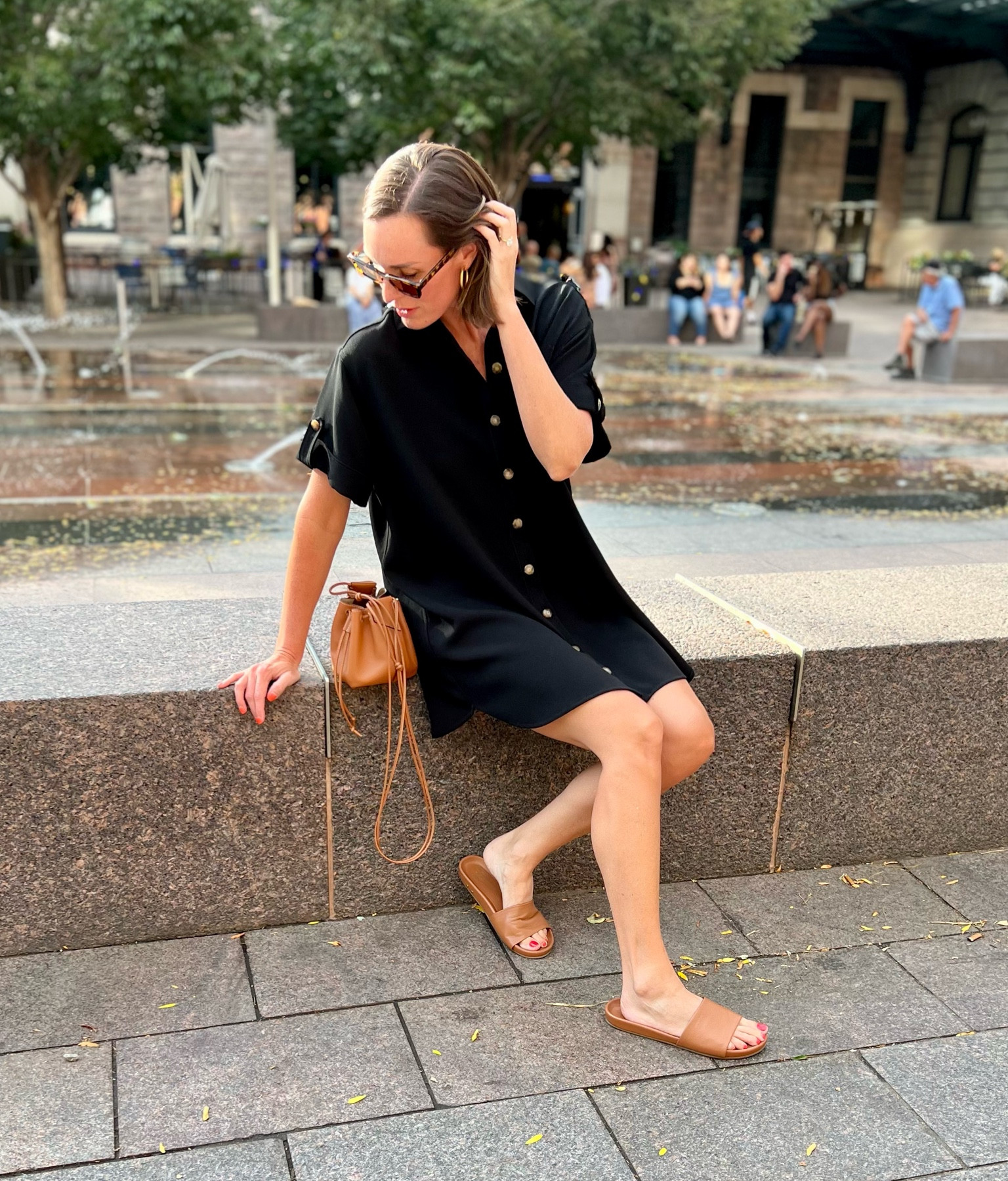Summertime outfit; summer look. A button down shirt dress is a fun, flirty, yet polished, super simple outfit option! Accessorize with some beautiful leather pieces—like this fab brown mini bucket bag—easy slide sandals, and don’t forget your sunglasses! You’re set with a classic, beautiful look 💕

#LTKstyletip #LTKSeasonal