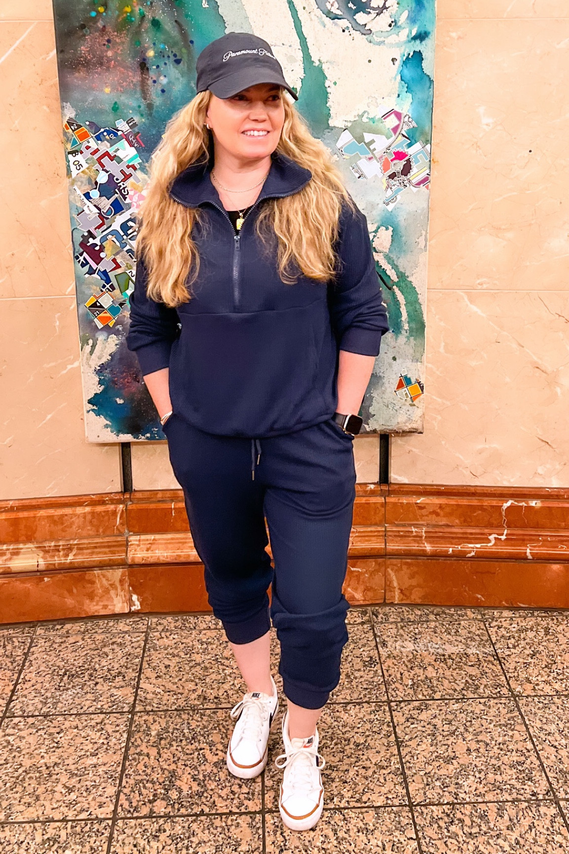 Sweatsuit Set - several color options.  I love the half zip pullover sweatshirt.  The pants have pockets and tie at the waist.  I’m wearing a medium. I’m also wearing the backpack in this photo but you can’t see it.  It’s so convenient for travel! 

#LTKStyleTip #LTKFindsUnder50 #LTKTravel
