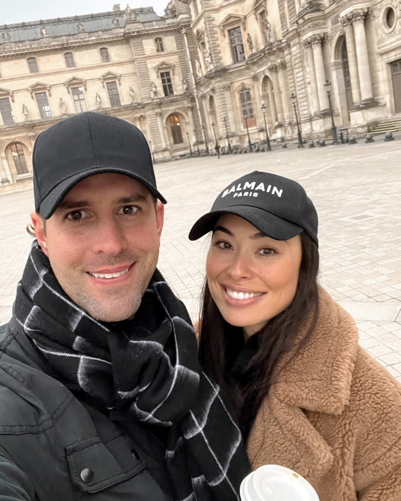 Kat Jamieson of With Love From Kat shares a couple's travel outfit. Baseball cap, plaid scarf, teddy coat, Paris style, men's fashion, classic style. Rag & Bone scarf sold out as well as the Gerard Darel coat, similar linked below!

#LTKmens #LTKstyletip #LTKtravel