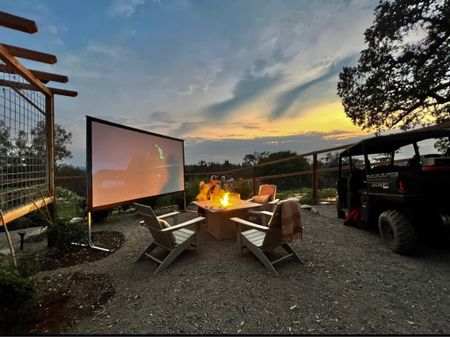Outdoor projector & movie night set up. Perfect for fall fireplace & roasting marshmallows by the fore 

#LTKhome #LTKsalealert #LTKSeasonal