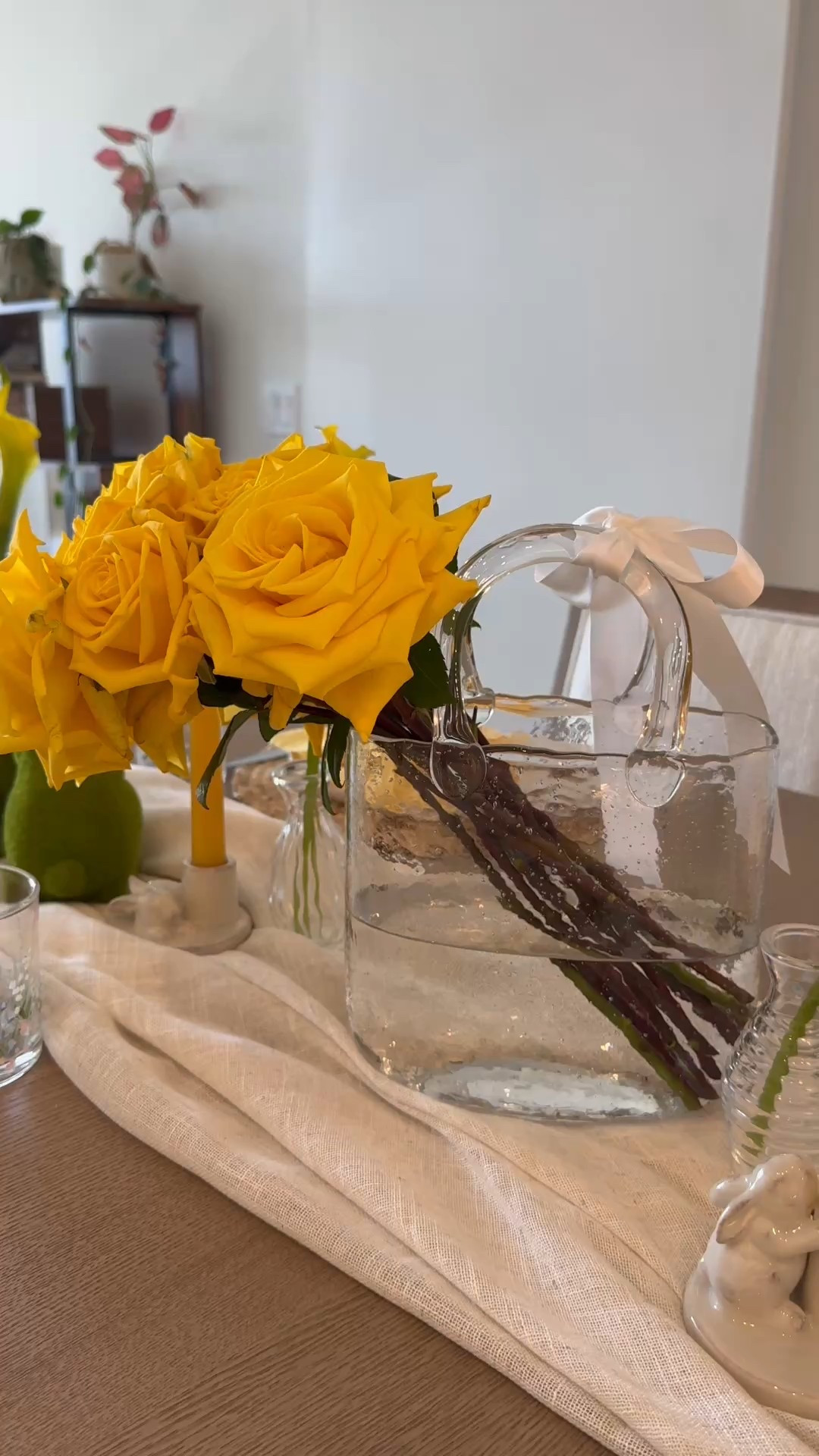 Nothing says spring like yellow roses in a glass purse vase! 🌼✨ 

#LTKHome #LTKSeasonal #LTKParties