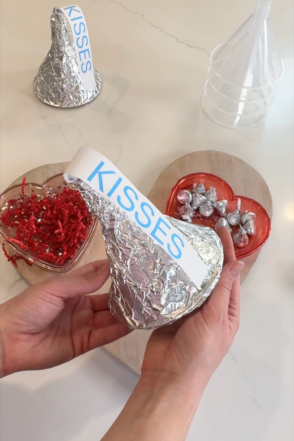 Turn up the fun this Valentine’s Day with these DIY Giant Kisses! 💋 They’re crazy easy to make and guaranteed to spread some extra love. Start by attaching a custom label to the top of a funnel, pack it full of candy and tiny surprises, then seal it with plastic wrap. The grand finale? Wrap it up in shiny tin foil for the ultimate V-Day wow factor! These are perfect for kids, teachers, or anyone who deserves a little sweetness. Who wouldn’t want a kiss this big?! ❤️

#ValentinesDayFun #CraftingWithLove #DIYValentineGifts #GiantKisses #SweetSurprises #ValentinesDayIdeas #VDAYVibes

#LTKParties #LTKFamily #LTKSeasonal