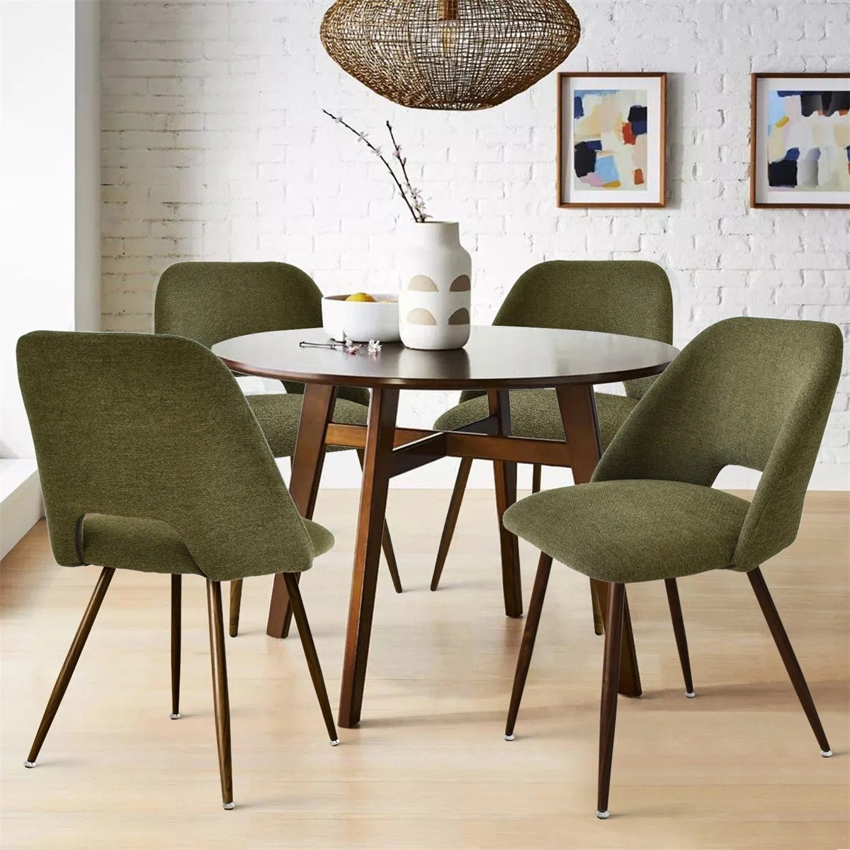 These Aunnika upholstered dining chairs by Wade Logan are such a stylish way to elevate your dining space. The soft green fabric paired with the sleek tapered legs gives a modern mid century feel that’s both comfortable and elevated. Styled with a round wood dining table, woven pendant light, and neutral decor for a warm, inviting setup that’s perfect for everyday meals or hosting. #diningroomdecor

#LTKSaleAlert #LTKHome