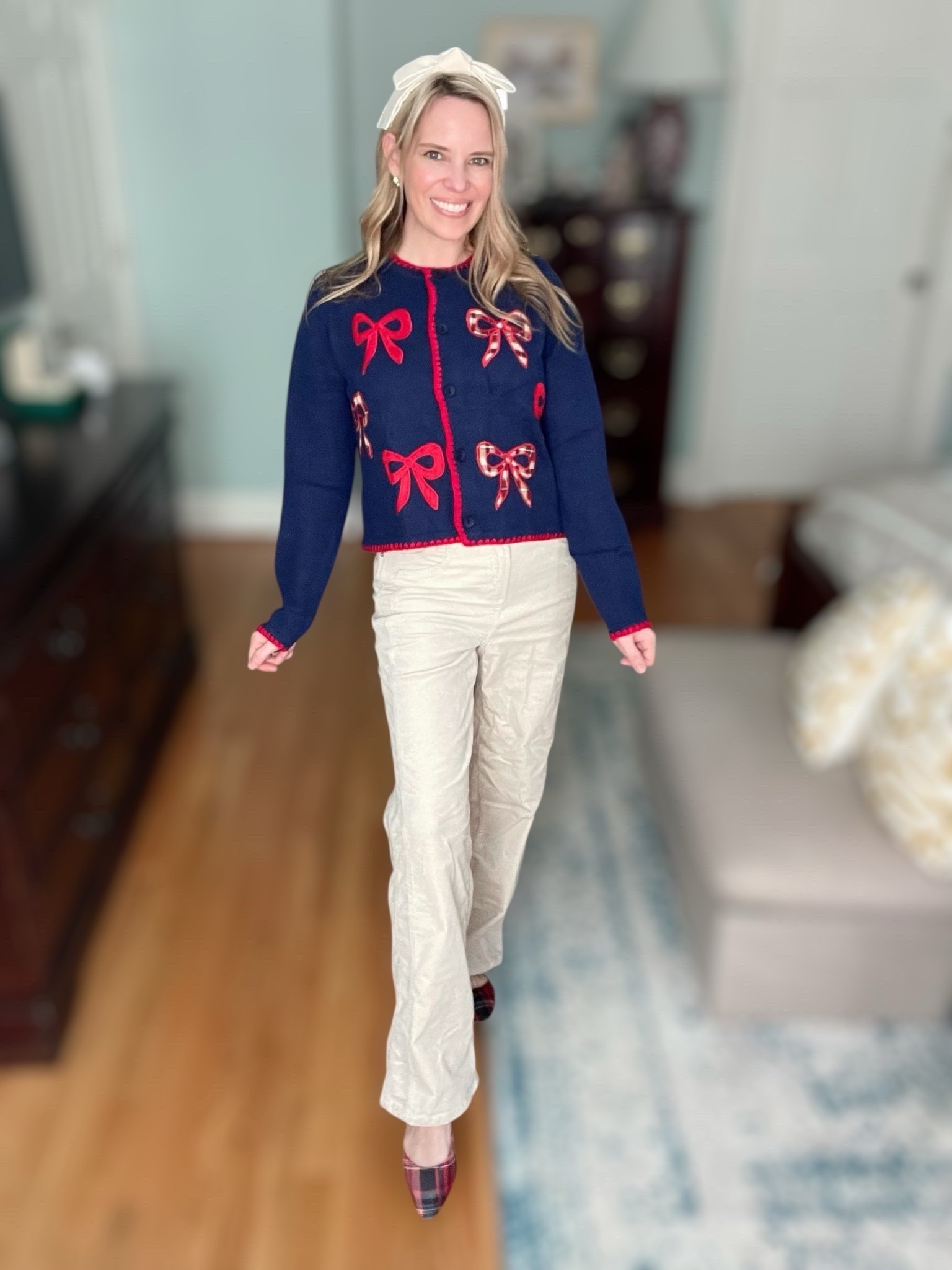 🎀 Festive bows and timeless neutrals! This adorable navy cardigan with red bow details gives instant holiday cheer while still feeling polished and classic. I paired it with soft corduroy trousers for texture and warmth, plus plaid flats for a preppy finishing touch. The oversized ivory bow headband adds a sweet and feminine twist — perfect for holiday gatherings, coffee dates, or festive office days.

Outfit Details:
	•	Cardigan: CIDER Cute Cardigan Sweater with Bows (Amazon)
	•	Pants: Time and Tru Women’s Corduroy Pants (Walmart)
	•	Shoes: CUSHIONAIRE Women’s Sleeper Mary Jane Flats (Amazon)
	•	Bag: Miss Left Buckle Strap Shoulder Bag (Amazon)
	•	Earrings: With a Twist Hoops (Melinda Maria Jewelry)

💡 Style tip: Play up the red and navy tones by adding a tartan accessory — it ties this preppy holiday look together beautifully!

⸻


holiday bow cardigan outfit, navy and red Christmas outfit, Cider bow sweater Amazon find, festive outfit ideas 2025, corduroy pants outfit fall winter, plaid flats holiday style, classic preppy winter outfit, Christmas cardigan outfit inspo, feminine holiday outfit ideas, timeless navy red outfit


#LTKOver40 #LTKFindsUnder100 #LTKFindsUnder50

#LTKFindsUnder50 #LTKHoliday #LTKFindsUnder100