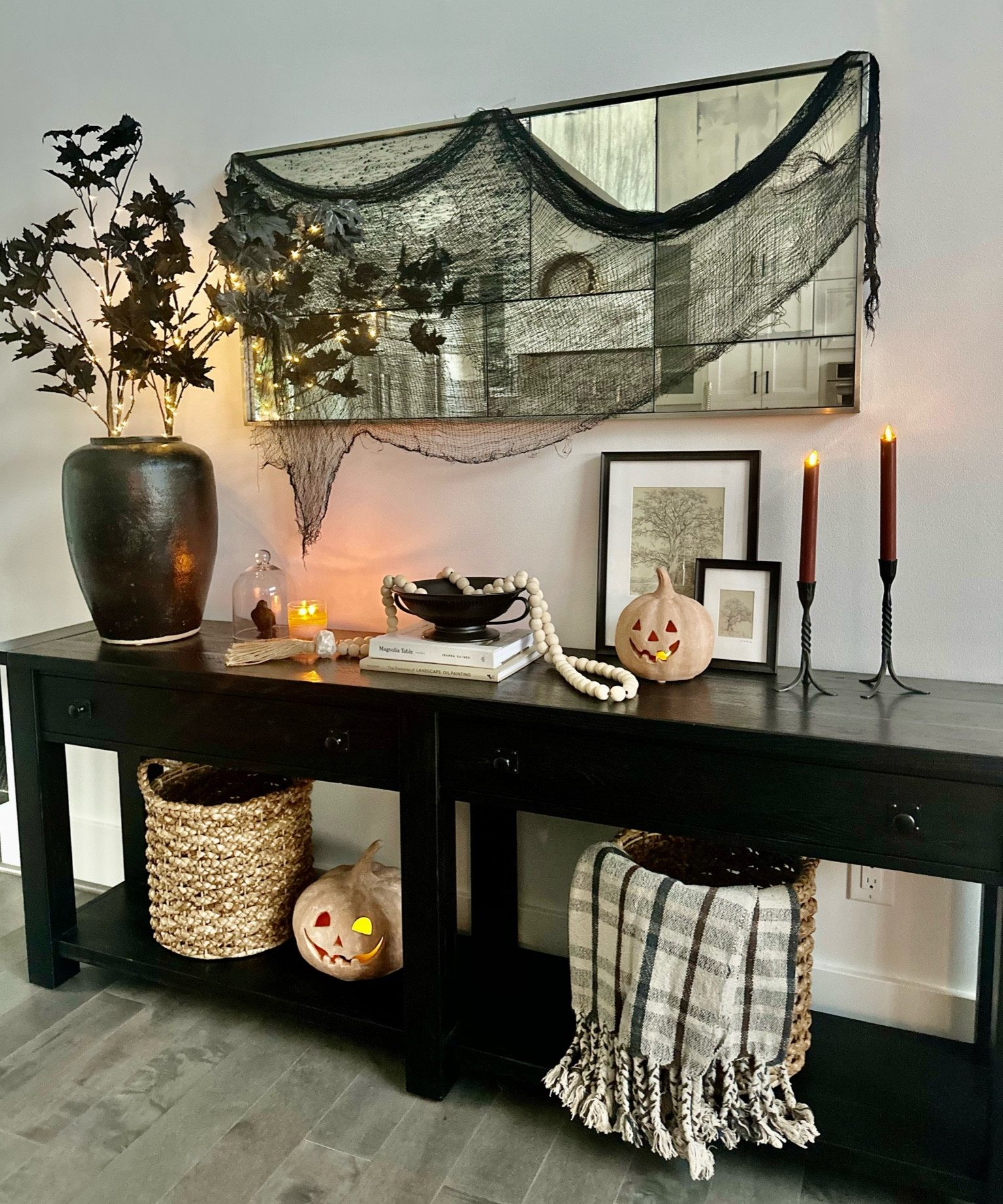 Halloween Console! 🎃 

I love a “collected” look. Especially for Halloween. Mixing vintage textures and pieces that have character and interest make for a surprisingly spooky setting 👻 

Linked everything I could! The terracotta Jack o lanterns are from pottery barn and a best seller for two years now! They sell out so quickly! The art is from the hearth and hand fall collection! 

McGee and co | spooky chic Halloween | pottery barn Halloween | creepy cloth | antique mirror | hearth and hand art | flameless flicker candle | Rosario candle holders | McGee and co throw | plaid throw | woven baskets | pottery barn terracotta jack o lanterns | fluted bowl | decorative crow | Amazon Halloween | pottery barn vase | benchwright console | Halloween inspo

#LTKHalloween #LTKhome