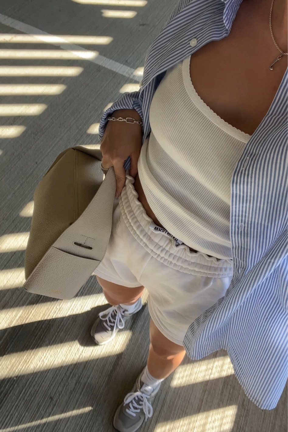 Striped pyjama shirt styled with scoop neck vest and white sweat shorts for a simple summer casual outfit, worn with grey new balance 574s for off duty vibes 

#LTKGiftGuide #LTKunder100 #LTKstyletip