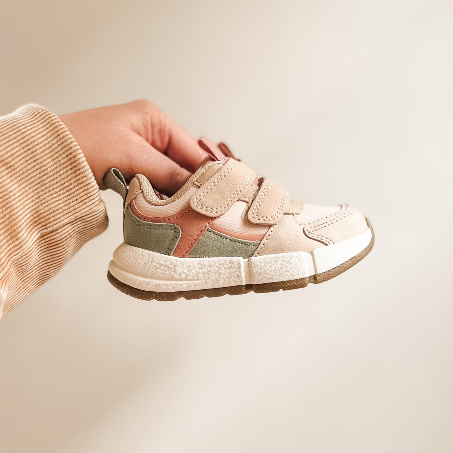 Neutral trainer for kids with green & blush accents 

#LTKbaby #LTKkids #LTKSeasonal