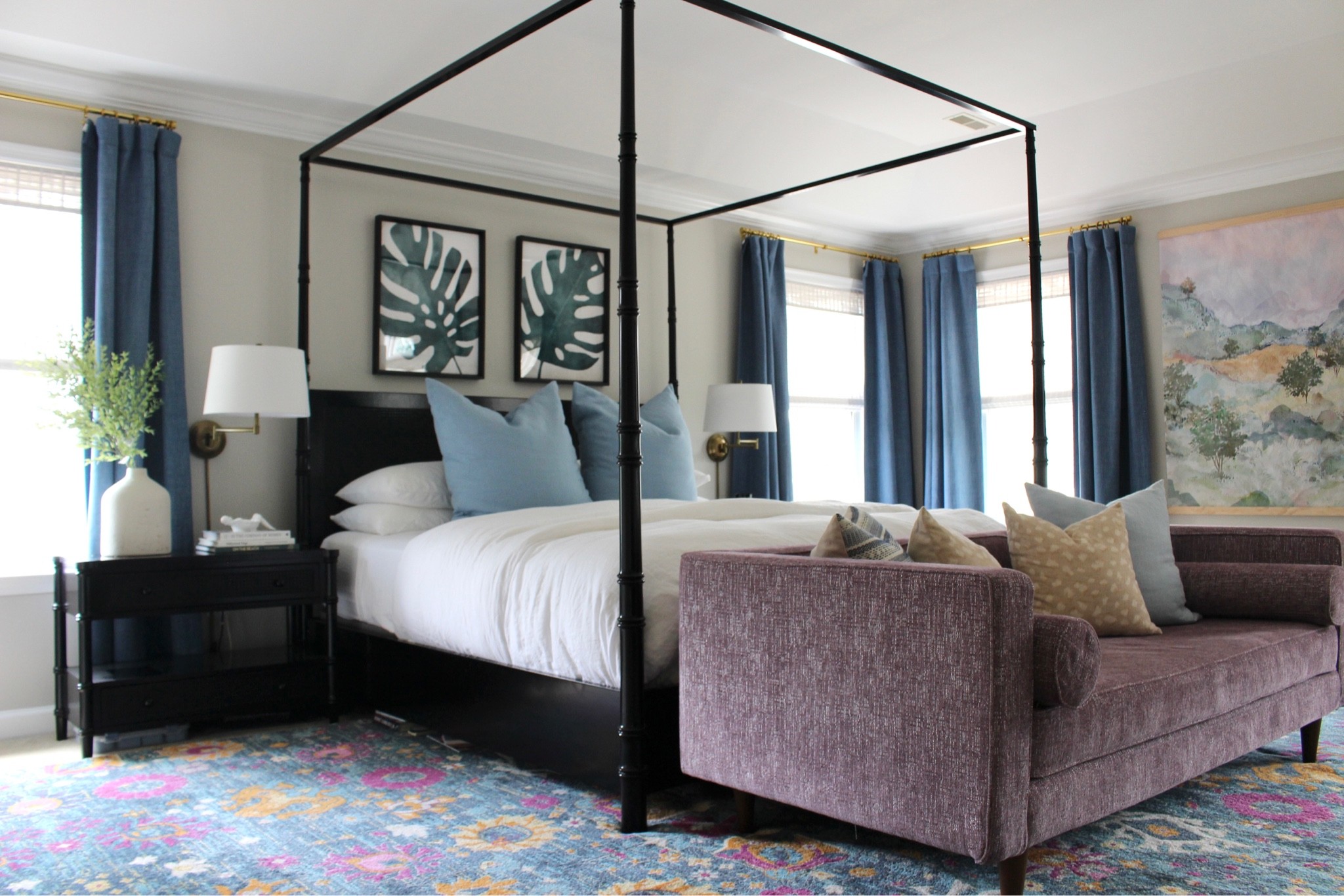 Primary bedroom that is equal parts tropical, serene, and fun! The best bedding and sleeping pillows on this gorgeous canopy king queen bed. Large nightstands and plug in sconces. Gorgeous curtains and area rug. Affordable rug. End of bed seating  

#LTKhome #LTKunder50 #LTKunder100