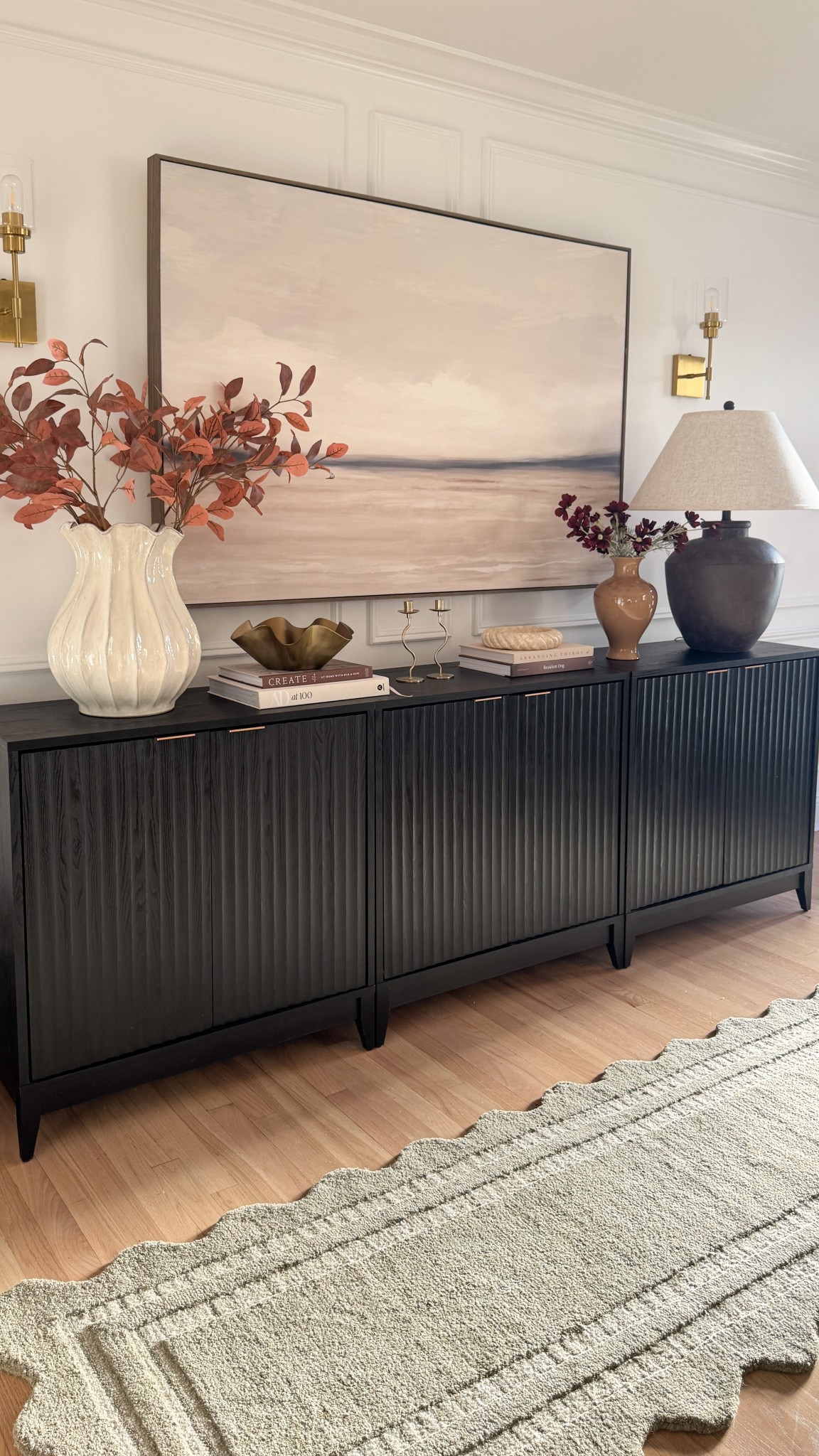 Elevated console styling that feels designer but still so affordable 🤎
This scalloped vase + faux stems combo is a Target find I keep coming back to—it instantly adds that warm, moody fall vibe to the whole setup. Paired with layered books, a statement lamp, and my favorite textured cabinet, it all ties together for a look that feels high-end without the price tag.


#TargetFinds #HomeInspo #EntrywayStyling #ConsoleTableDecor #LTKHome #LTKFinds