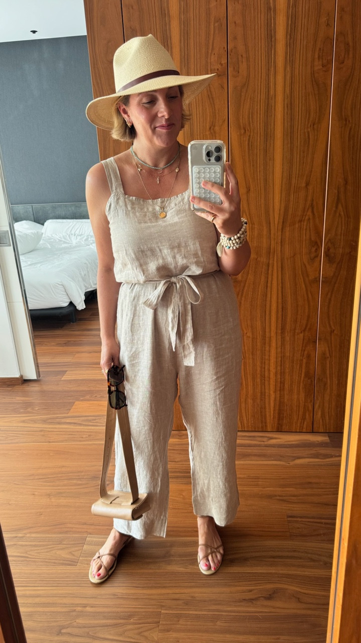 Sightseeing in Barcelona outfit 🇪🇸

Use code “GTI15” for 15% off this or any Janessa Leone packable hat 👏🏻

Allison is off to explore in this breezy tie-wait linen romper and Janessa Leone hat. Her exact bag not available- linking similar! 

These sandals are chic, but also comfortable for lots of walking. 

Sizing:
Romper runs tts. Allison wearing a medium. Shoes are tts. 

#LTKOver40 #LTKTravel #LTKSeasonal