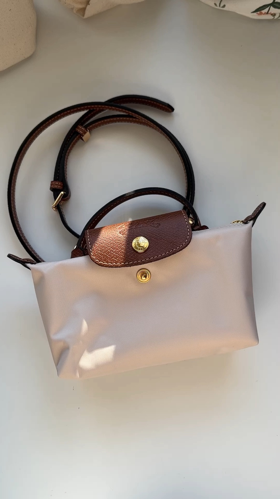 Longchamp pouch converted to a little crossbody ! 

#LTKitbag #LTKVideo #LTKfindsunder100