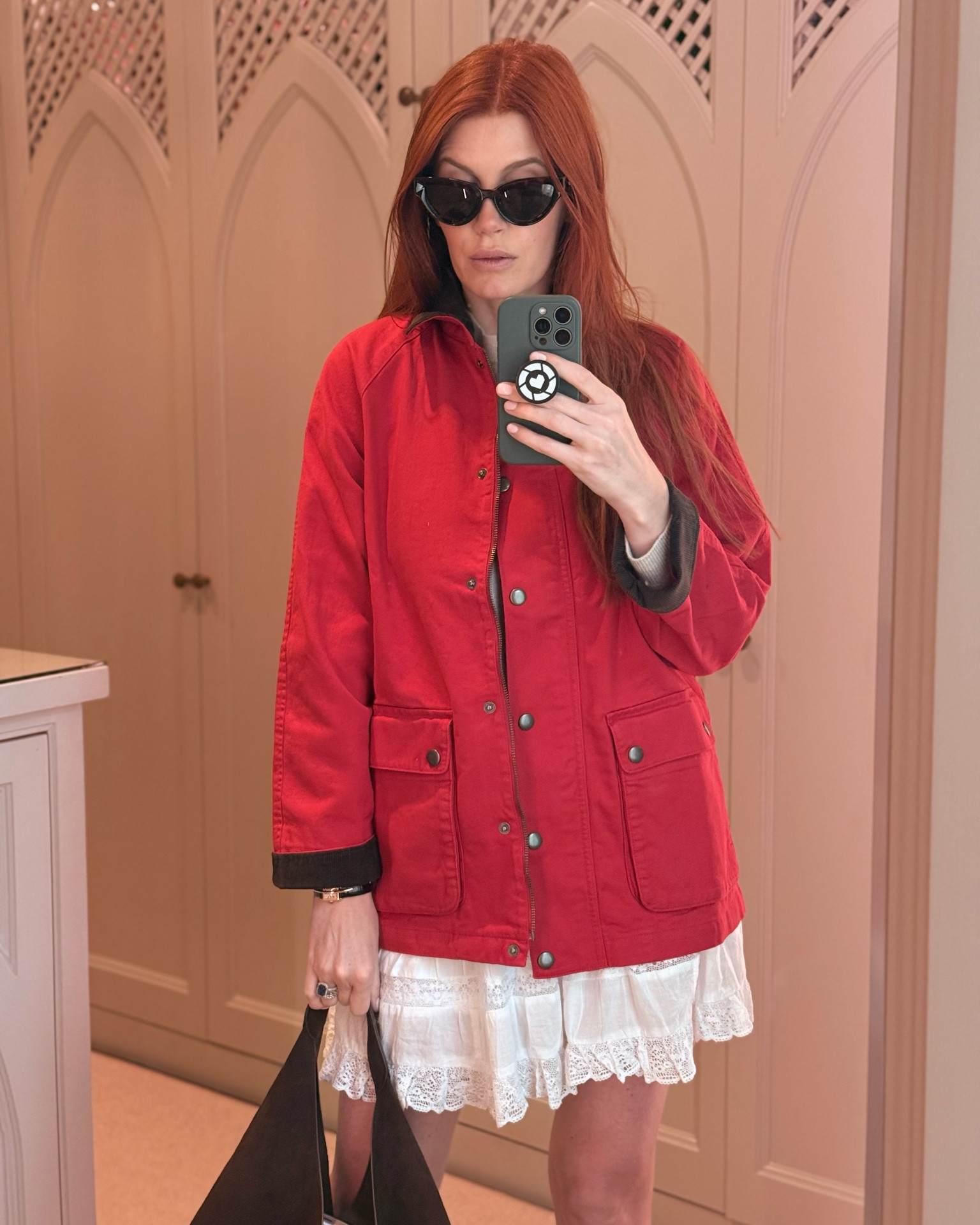 TREND ALERT! Red barn coats are going strong across all price points. Of course it all starts with the designer version - and many shows up quickly for this trend. 
Mine is a total steal and somehow on sale! I’m wearing a size small. 

Also- don’t sleep on my lace skirt and top - the skirt has built in shorts!

#LTKMothersDay #LTKootd