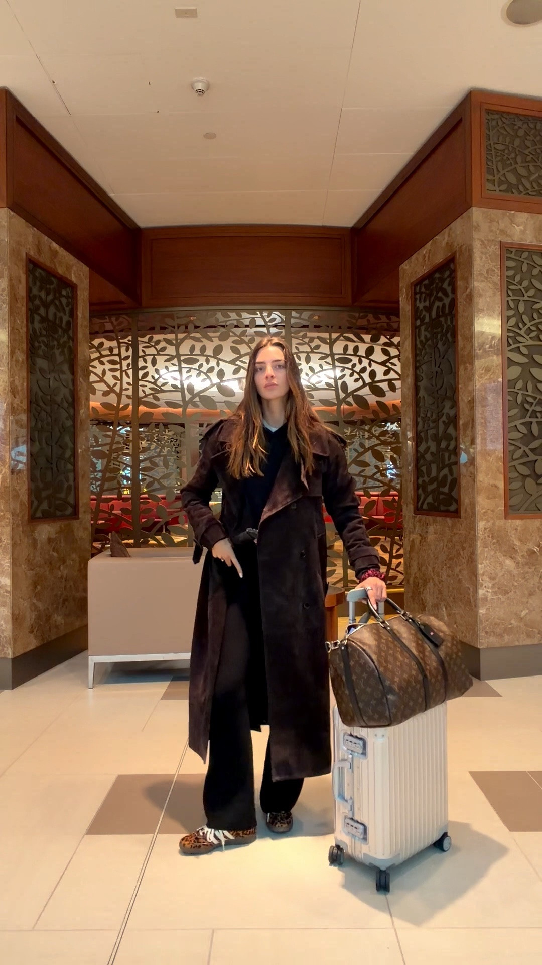 Airport outfit, skims hoodie, Desavary suede trench coat, leopard print sambas adidas 

#LTKTravel #LTKootd