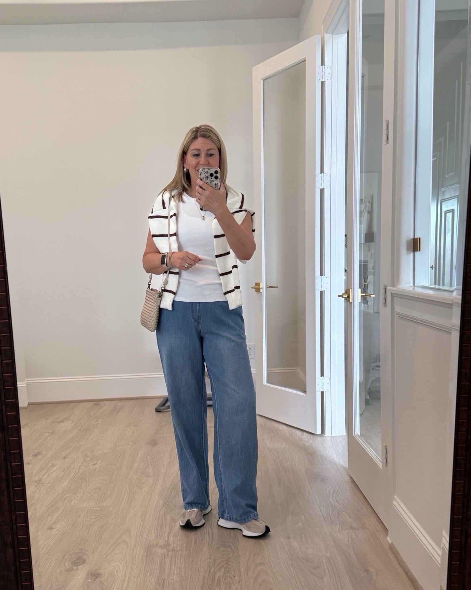 Comfy outfit for autumn outings and travel!🍂✈️ This pair of drawstring denim is especially comfortable for travel! The perfect white ribbed tank and a cotton striped sweater just in case. And my favorite New Balance sneakers. 💯  

#LTKSeasonal #LTKShoeCrush #LTKSaleAlert #LTKFindsUnder50 #LTKOver40 #LTKStyleTip #LTKWorkwear #LTKShoeCrush #LTKMidsize #LTKTravel