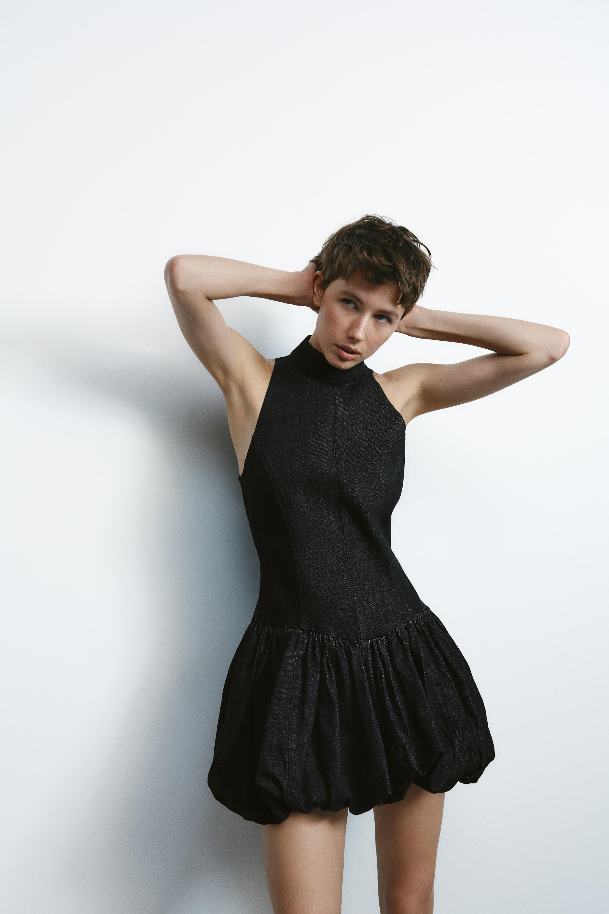 Sleeveless mini dress with high collar. Balloon hem with interior elastic. Invisible back zip clo... | Zara US