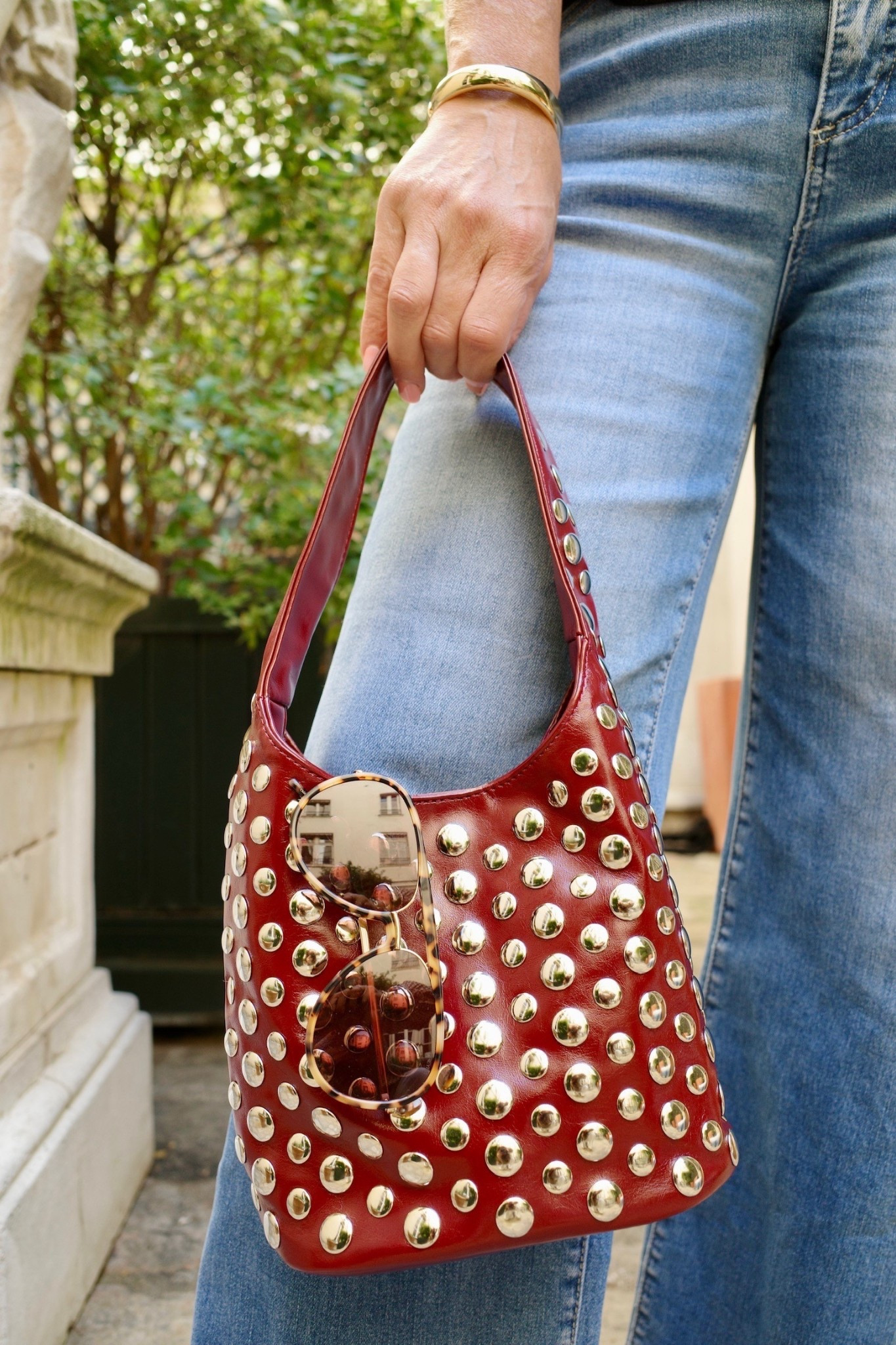 Statement accessories make the outfit. This studded bag in deep red adds the perfect pop of edge while still being versatile enough for everyday wear. A Paris-approved piece we’ll be styling on repeat. 

#LTKSeasonal #LTKOver40 #LTKMidsize