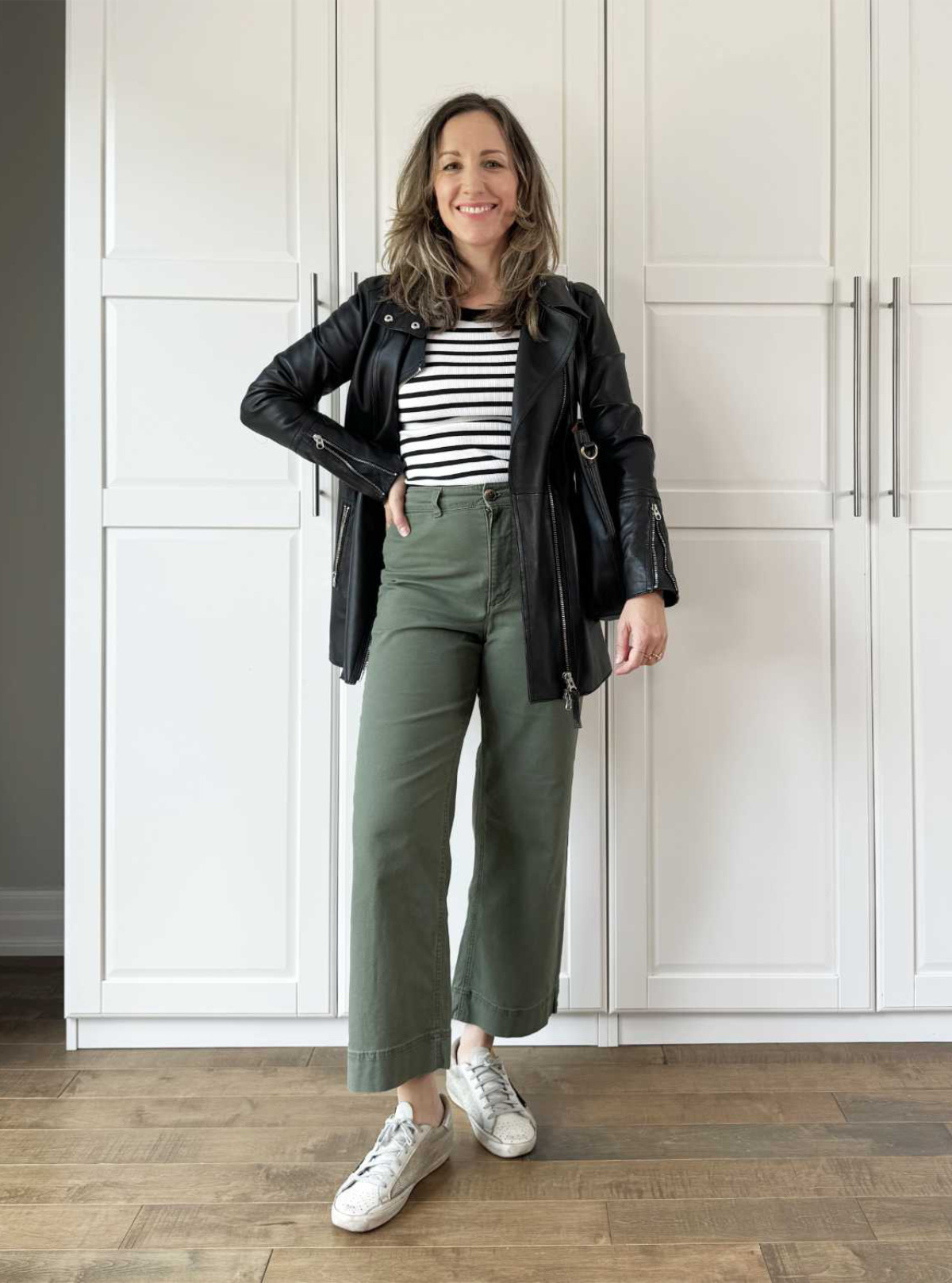 Olive green pants with stripe tank and leather jacket- fall outfit 

#LTKOver40 #LTKSeasonal