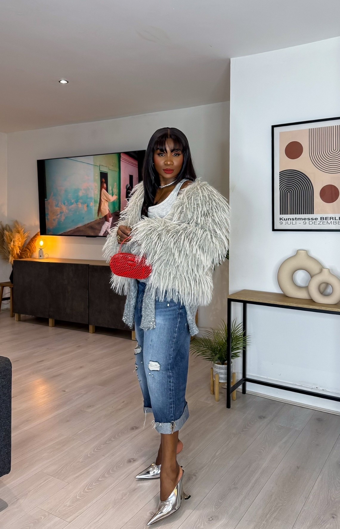 The textures, the denim, the pop of red — it’s giving effortlessly expensive.
