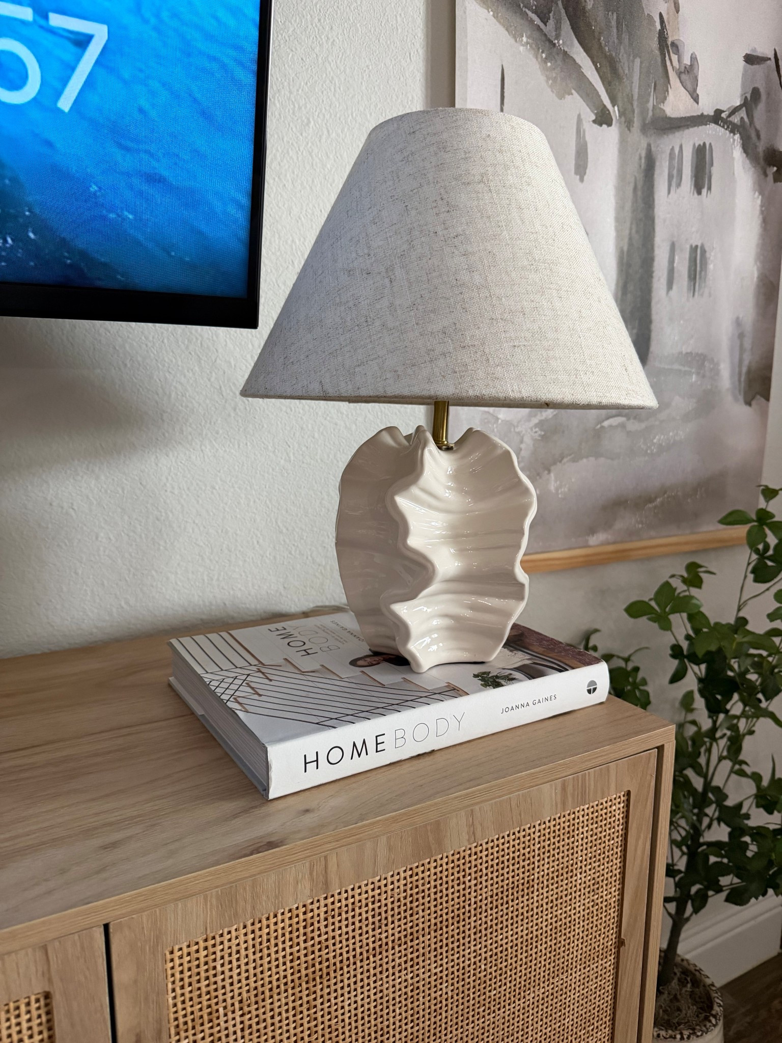 This Threshold designed with Studio McGee coastal lamp is one of those pieces that instantly elevates a space. The sculptural ceramic base and neutral linen shade give it that high-end coastal look without the high-end price. I styled it on my living room console, and it adds the perfect soft, warm glow while doubling as a statement piece. It’s the exact kind of timeless, neutral decor that works year-round and with any modern organic or coastal aesthetic. Studio McGee lighting always sells out quickly, and this one is even prettier in person.

#LTKCreator #LTKHome #StudioMcGee #ThresholdStudioMcGee #TargetHome #TargetFinds #CoastalHome #ModernOrganicHome #NeutralHomeDecor #HomeStyling #ConsoleTableStyling #HomeDecorFinds #AffordableHomeDecor #DesignerDupe #LTKUnder100

#LTKSaleAlert #LTKSeasonal #LTKHome
