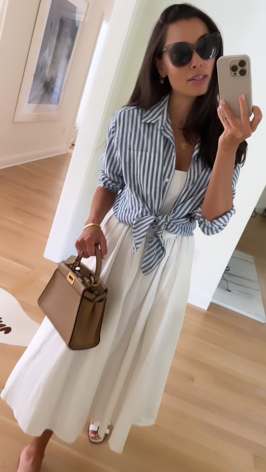 Stripe shirt and white dress, summer outfit, summer dress, Fendi bag, Hermes sandals. 

#LTKShoeCrush #LTKItBag #LTKSeasonal