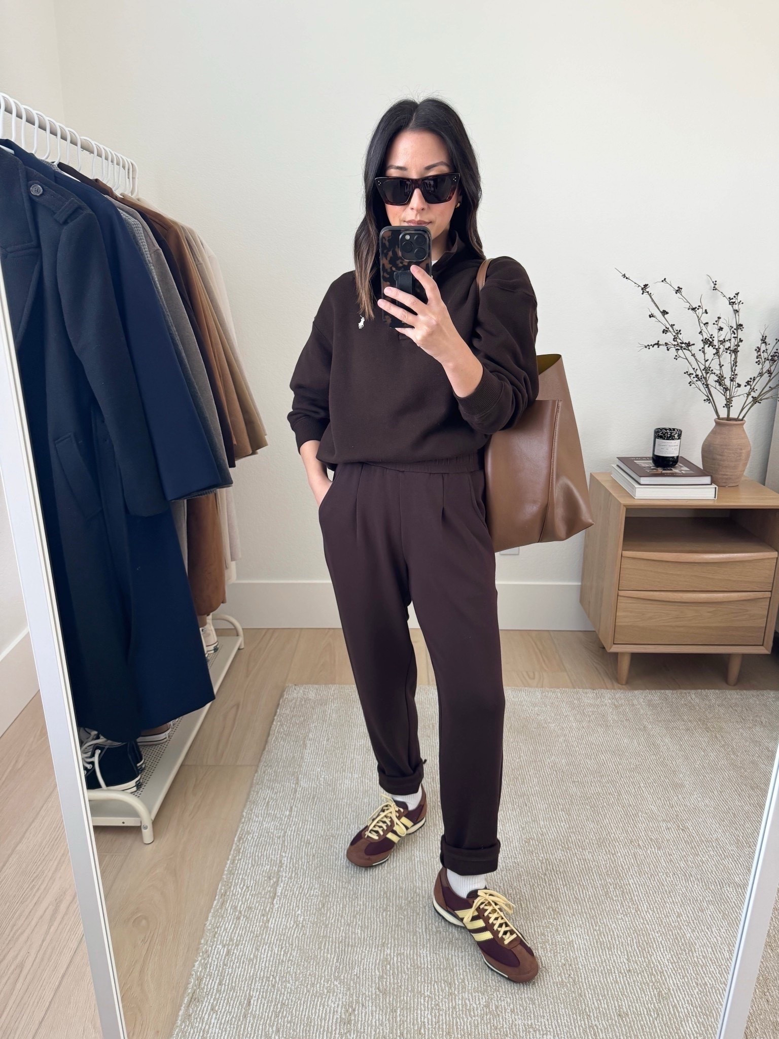 Athleisure outfit idea with chocolate brown.

Easy get out the door mom outfit ideas. Mom outfits. Look elevated while running errand. These Varley cuff pants have proven to be so versatile. There’s pleats in the front, giving trouser pants, but they’re leisure pants. 

Polo Ralph Lauren sweatshirt medium
Varley cuff pants xs 25" inseam
Adidas SL72 sneakers 5 womens
Mansur Gavriel tote
Celine sunglasses
Everlane tee medium

Fall outfits, fall style, petite style 



#LTKSeasonal #LTKPetite #LTKmomlife