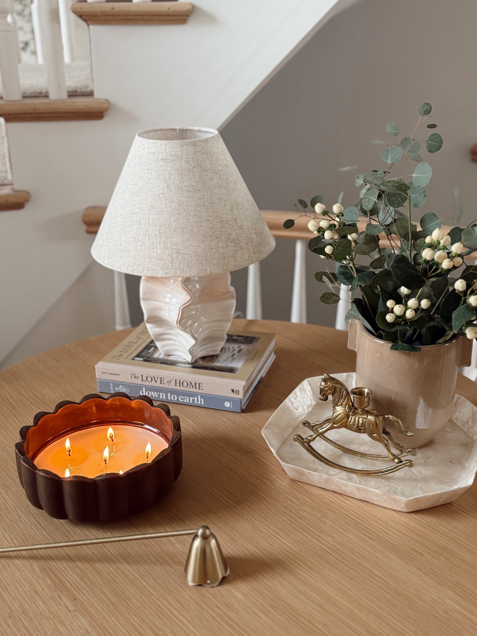 Entryway Refresh ✨🌿 switched up the decor on my table a little with a bit of new and a little bit old!

+ added in this new beautiful ottoman with hidden storage inside! Love the hexagonal shape, brown piping detail, and functionality 
+ new Target coastal lamp
+ new Target tray
+ older Target vase
+ vintage horse object from Etsy
+ candle and snuffer also from Target 
+ fresh eucalyptus and berry stems from Trader Joe’s! 

I’m loving it 🥰 now trying to decide if I should have one ottoman here or two? What do you think? 1️⃣ or ✌🏼?!



#LTKHome #LTKFindsUnder50 #LTKFindsUnder100
