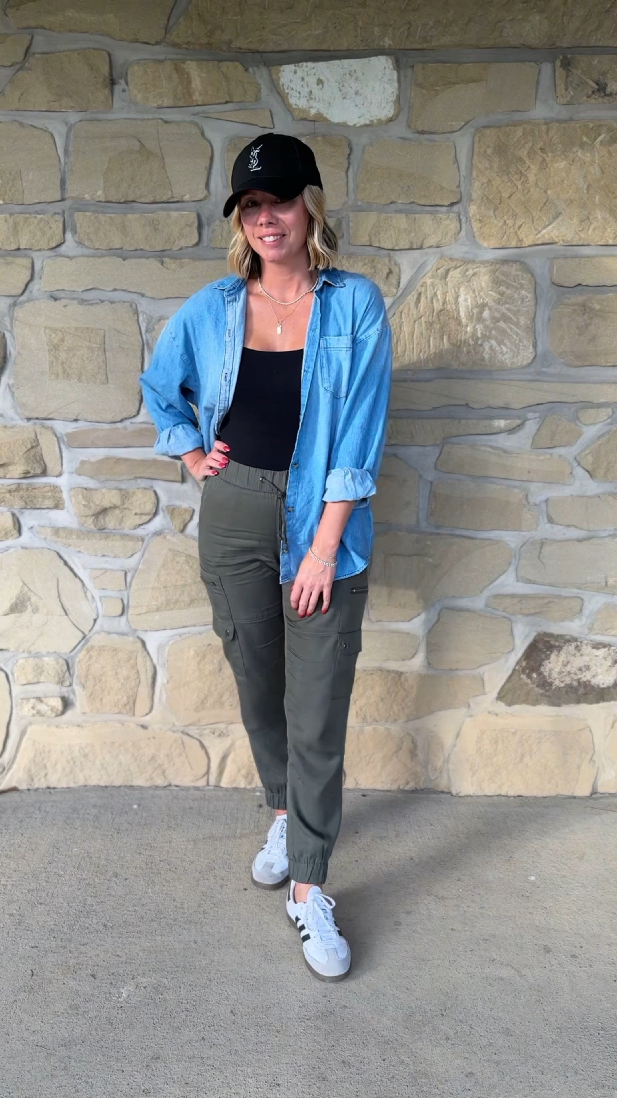 The perfect fall transitional outfit! 

Fashionably late mom
Olive joggers
Baseball cap
Chambray oversized top 
Adidas samba sneakers 