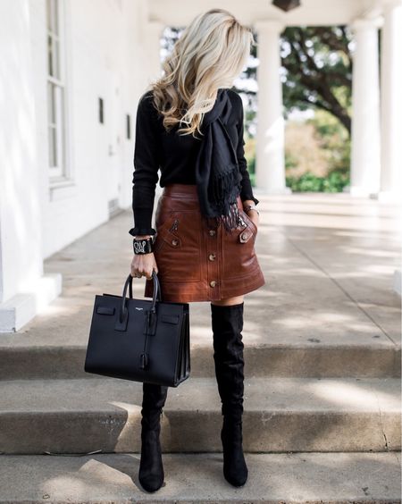Brown leather skirt, black sweater, black scarf, black over the knee boots, & Saint Laurent purse. 

#LTKSeasonal #LTKstyletip #LTKshoecrush