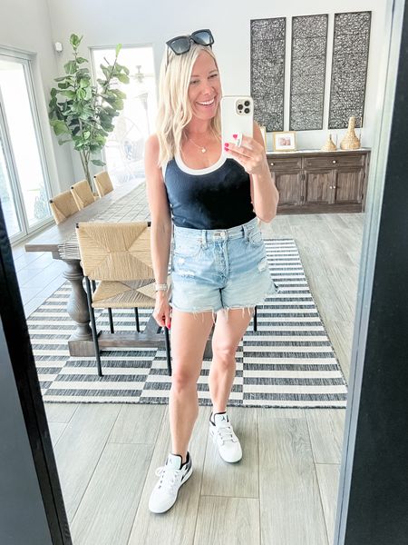 Love this black-and-white ribbed tank top with denim shorts, white Jordans sneakers and sunglasses. Size small tank top and size 26 shorts. Big kids size 6.5 shoes which is the same as a women’s eight. Casual outfit ideas.

#LTKover40 #LTKstyletip #LTKSeasonal