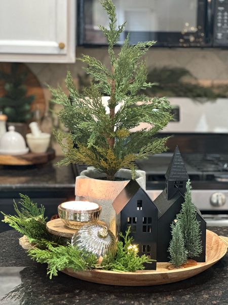 Beautiful Christmas kitchen arrangement with a pretty tray, mini Christmas tree, mini houses and trees, greenery stems, and a festive candle 

#LTKhome #LTKSeasonal #LTKHoliday