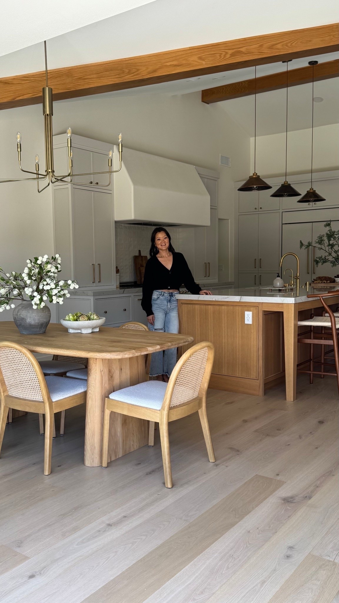 Our clients dining area furniture were such great finds! I love mixing high and love and the wood tones work perfectly together.
These chairs are such a great price point, comfortable, and so pretty with all the soft curves. The dining table is very sturdy and the rounded edges match the chairs so perfectly.
The affordable chandelier is the chefs kiss!

Wood dining table, arched dining chairs, white sofa, sectional, white tile, gray tile, wood, vanity, curved, vanity, runner, gray, scallop, rug, upholstered bed, wood, nightstand, black rectangular, mirror, brass faucet, kitchen, design, brass pendant, light bubble, chandelier, bathroom, design, blue runner, vintage, wood, side, chair, accent chair countertop, stool, girl, flower, bathroom, tile, white tile, rectangular tile oval mirror, brass hardware knob pull wood coffee table, Wood, oval rectangle, dining tablec couch 

#LTKHome #LTKSaleAlert