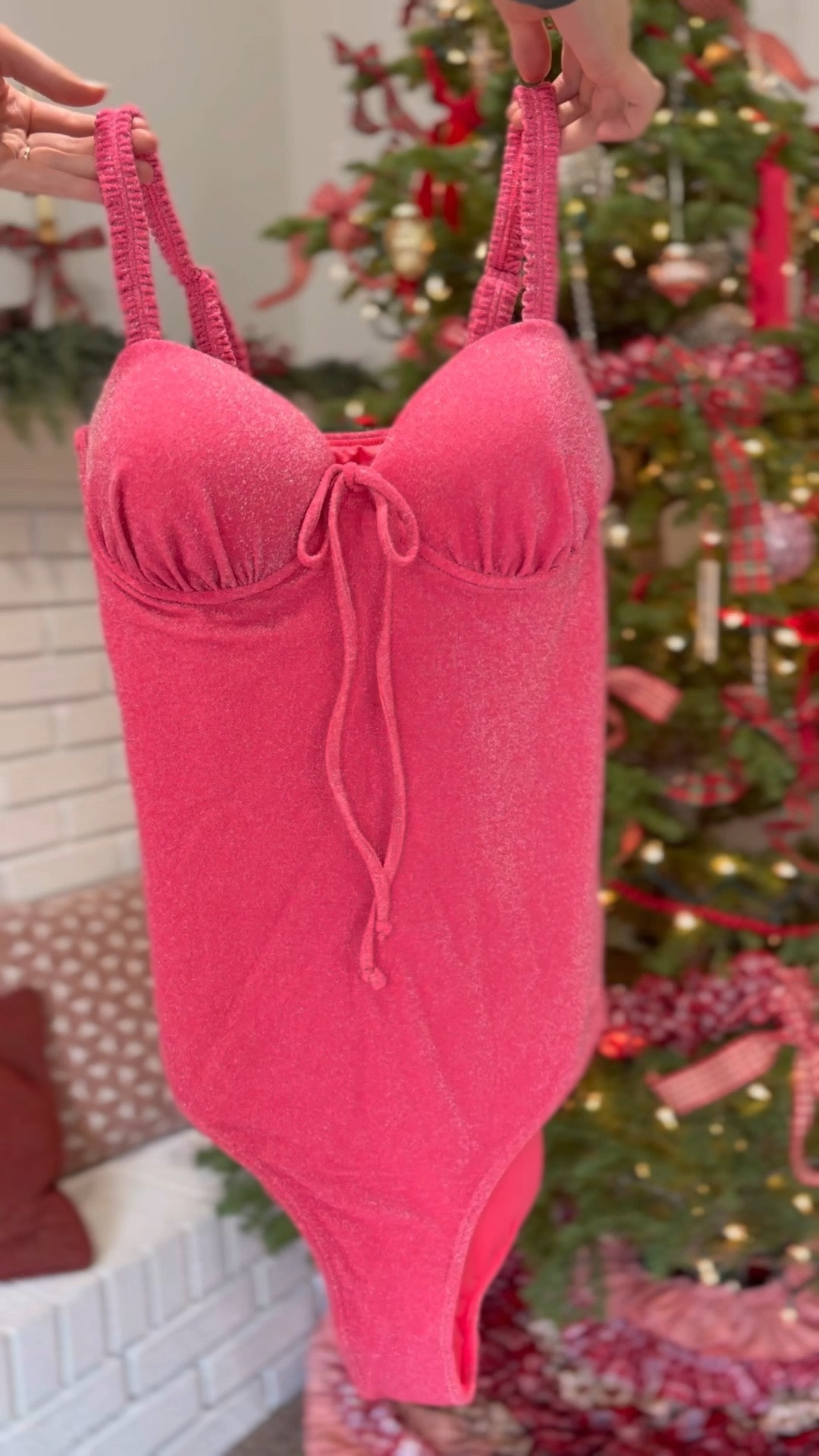 THE SWIMSUIT OF MY DREAMS 💗🤩

Why I love it so much:
- pink 
- sparkly ✨ 
- supportive 
- flattering 
- a bow 🎀
- works with bigger cup sizes
- coverage 
- adjustable straps
- & IS SO FREAKING CUTE 🤭

This swimsuit is seriously so flattering! It holds you in great.  The pink sparkles is MY FAVORITE part! It is so fun, girly, and cute! It is giving showgirl barbie! Comes in more styles including swim skirts, two pieces, and more! 