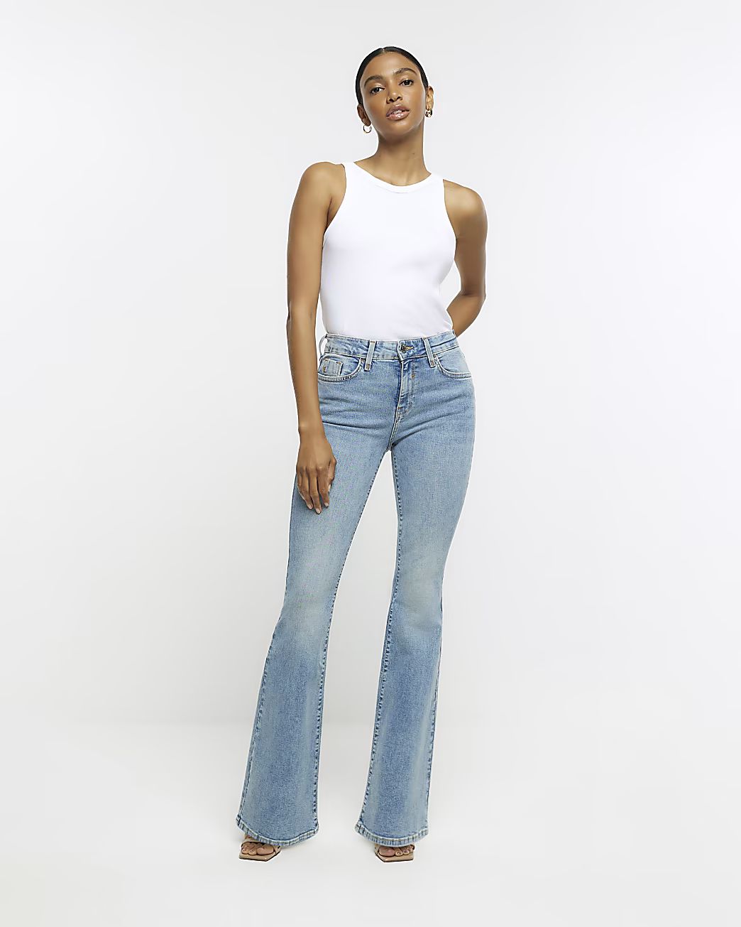 Blue high waisted flared jeans | River Island (UK & IE)