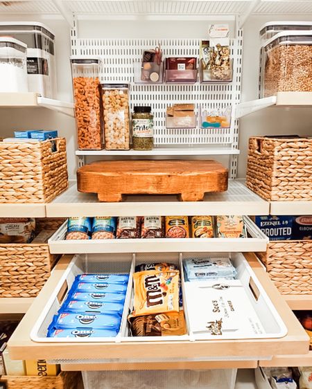 When it comes to space saving hacks, we know them all! In this one pantry section, we've got pull-out shelves, a customizable pegboard, water hyacinth baskets, clear oxo pop containers, and more which was the original intent when we designed and installed this Elfa pantry system. Creating spaces that really work for our clients is our goal and our focus for each project. Plus delighting our clients with new and functional spaces doesn't hurt!